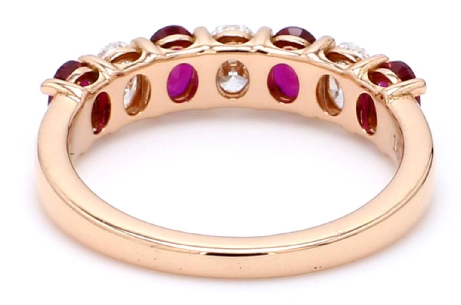 A Beautiful Handcrafted Ring in 18 Rose Karat Yellow Gold with Natural Brilliant Cut Oval Diamond and No Heat Mozambique Mined Rubies . A perfect Wedding Ring for the Special occasion. 

Natural Diamond Details
Pieces : 3 Pieces
Weight : 0.55 Carat
