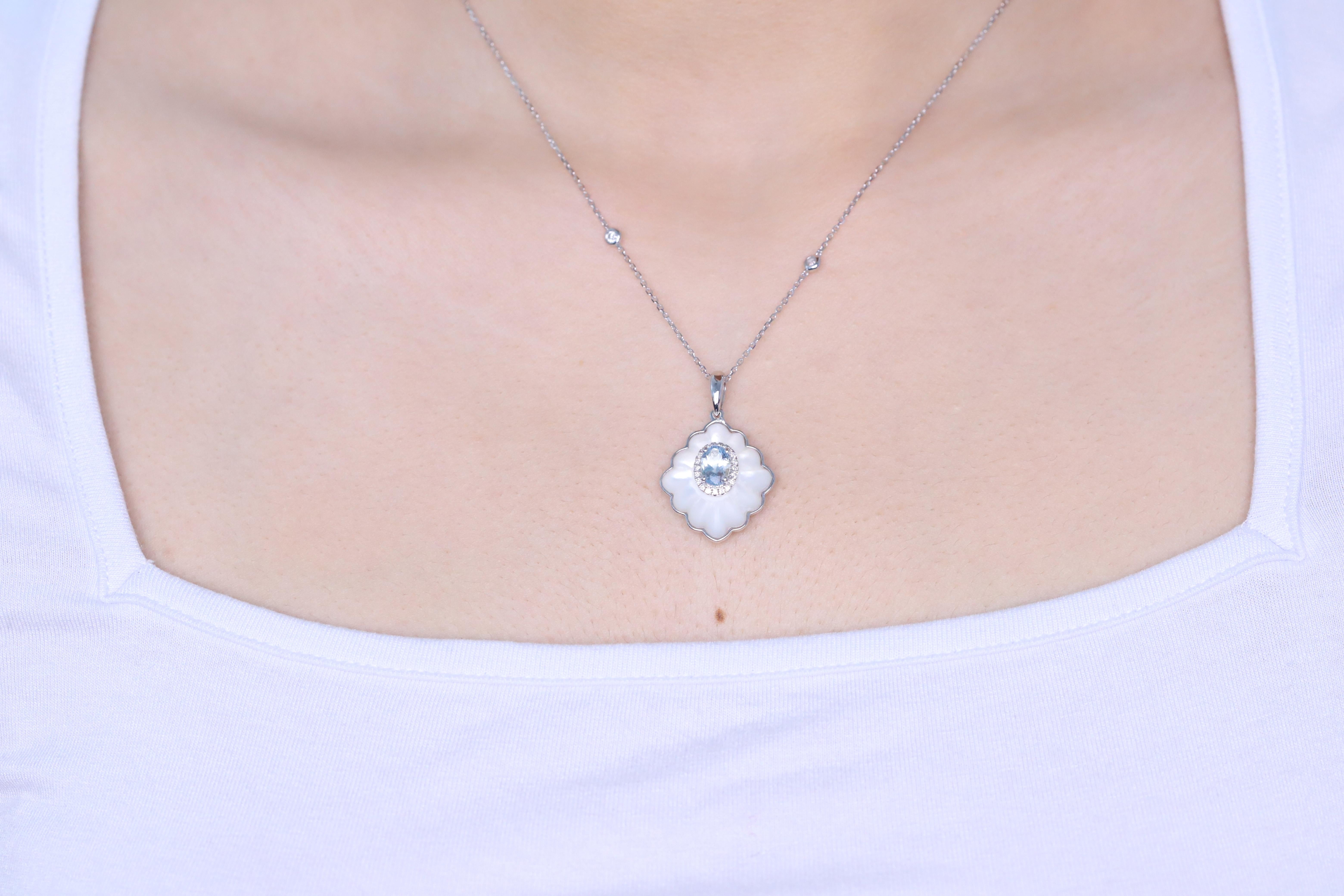 Decorate yourself in elegance with this Pendant is crafted from 14-karat White Gold by Gin & Grace. This Pendant is made up of oval-Cut Aquamarine (1 pcs) 0.75 carat, Fancy-cut Mother of Pearl Pink (1 pcs) 8.70 carat and Round-cut White Diamond (22