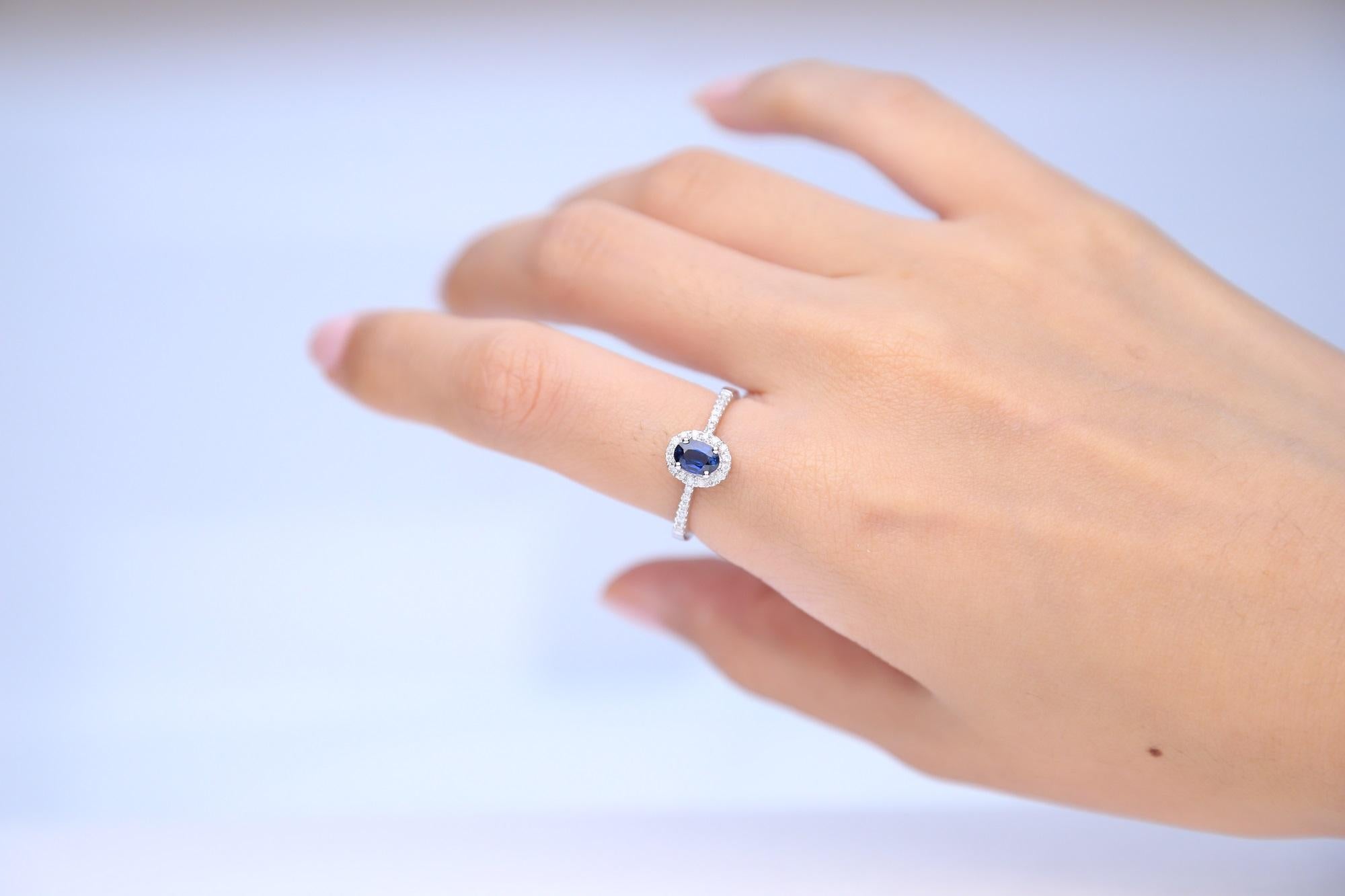 Stunning, timeless and classy eternity Unique Ring. Decorate yourself in luxury with this Gin & Grace Ring. The 14K White Gold jewelry boasts with Oval-cut 1 pcs 0.55 carat Blue Sapphire and Natural Round-cut white Diamond (28 Pcs) 0.16 Carat accent