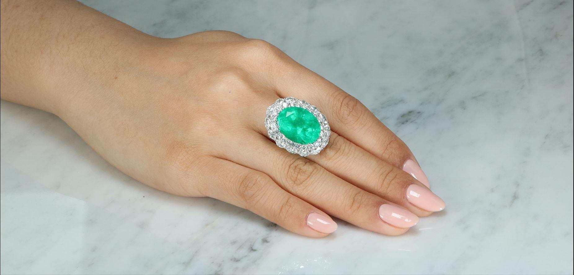 Stunning, timeless and classy eternity Unique Ring. Decorate yourself in luxury with this Gin & Grace Ring. The 18K White Gold jewelry boasts with Oval-cut (1 pcs) 12.23 carat Emerald and Natural white Diamond Marquise-cut (14 Pcs) 1.60 carat,