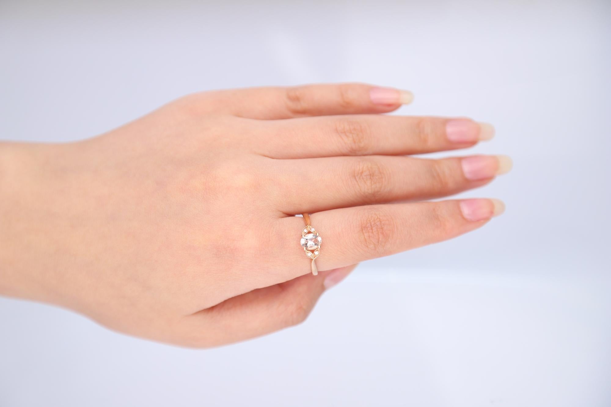 Stunning, timeless and classy eternity Unique Ring. Decorate yourself in luxury with this Gin & Grace Ring. The 14K Rose Gold jewelry boasts with Oval-cut 1 pcs 0.68 carat Morganite and Natural Round-cut white Diamond (4 Pcs) 0.03 Carat accent