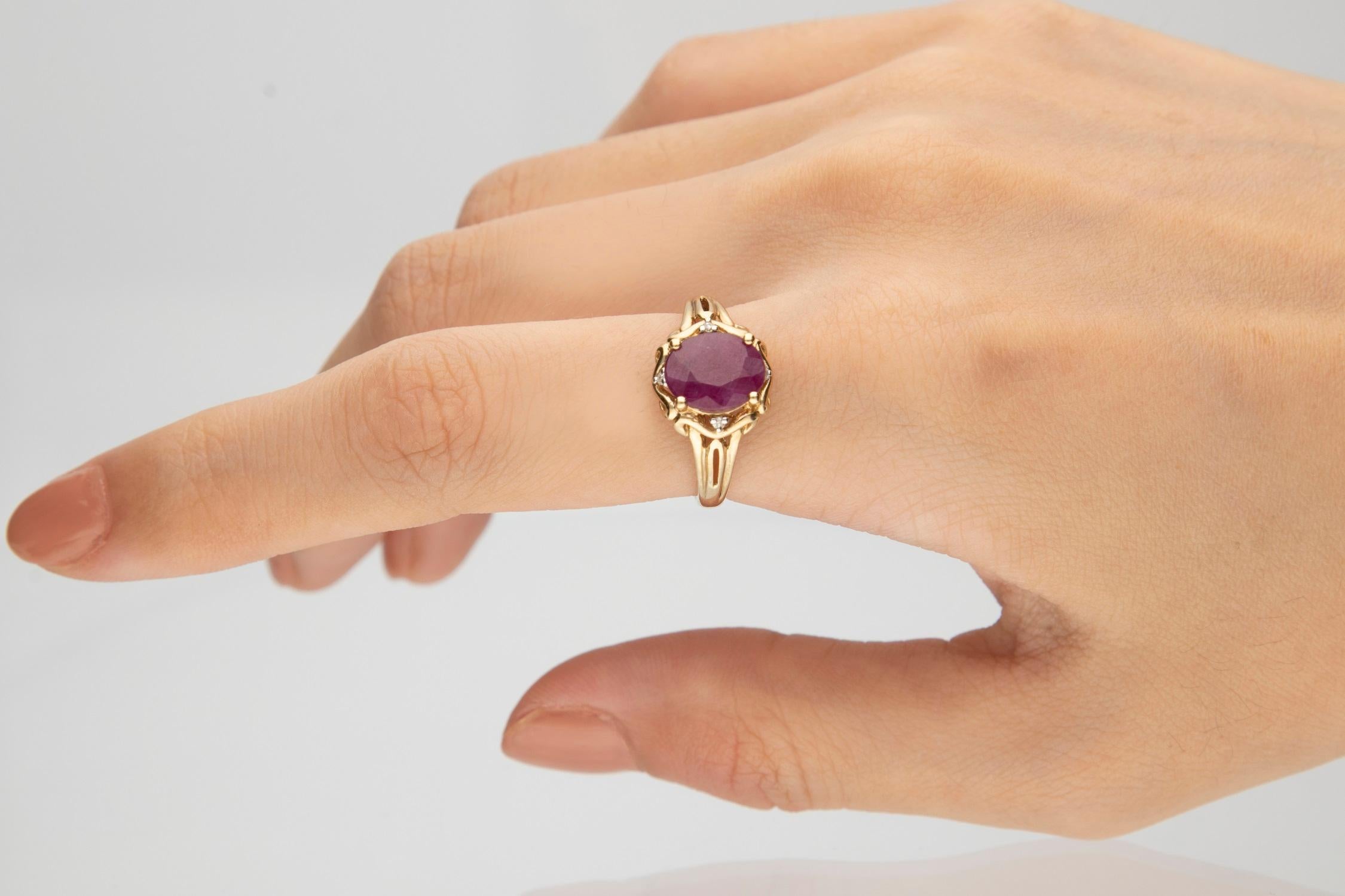 Stunning, timeless and classy eternity Unique Ring. Decorate yourself in luxury with this Gin & Grace Ring. The 10K Yellow Gold jewelry boasts with Oval-cut 1 pcs 2.22 carat Ruby and Natural Round-cut white Diamond (4 Pcs) 0.03 Carat accent stones