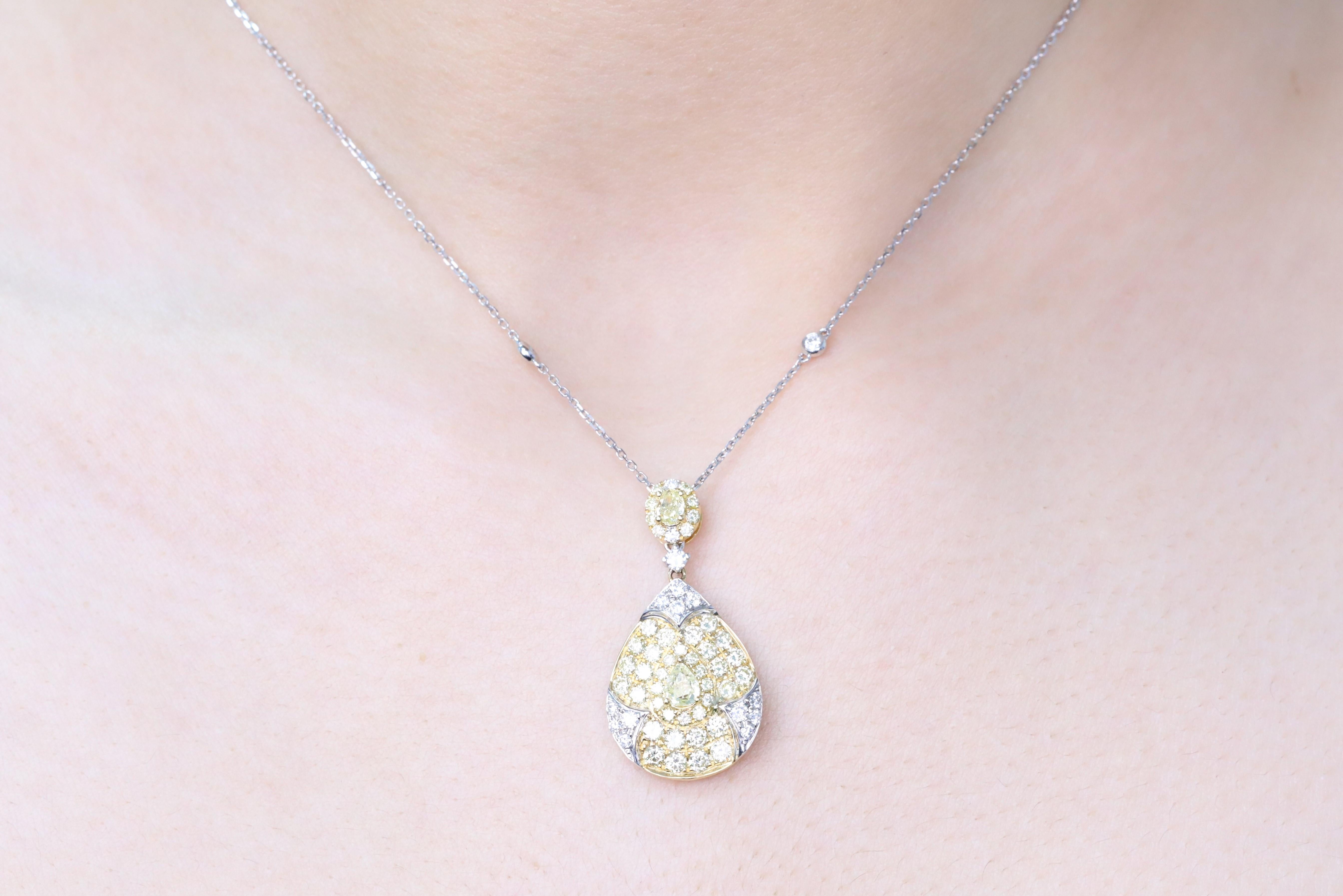 Decorate yourself in elegance with this Pendant is crafted from 18-karat Two Tone Gold by Gin & Grace. This Pendant is made up of oval, Pear-Cut (2 pcs) 0.54 carat Round-cut Yellow Diamond (44 pcs) 1.25 carat and Round-cut White Diamond (17 Pcs)