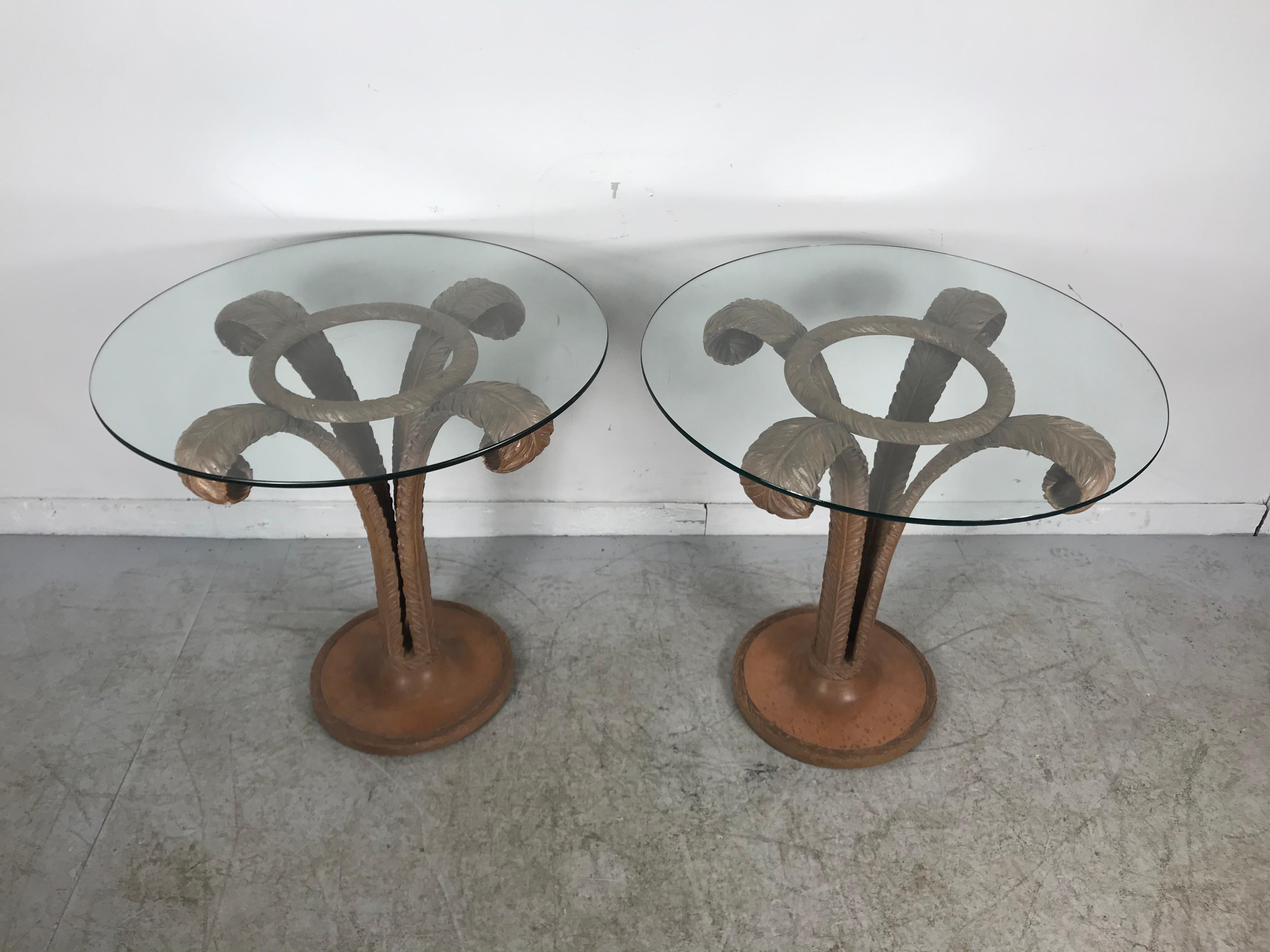 Art Deco carved wood plume side tables by Grosfeld House made of three wood plume leaves opening up from the center of the base to the border of the glass top. This table has highly detailed carved accents and trim with a plate glass tabletop,