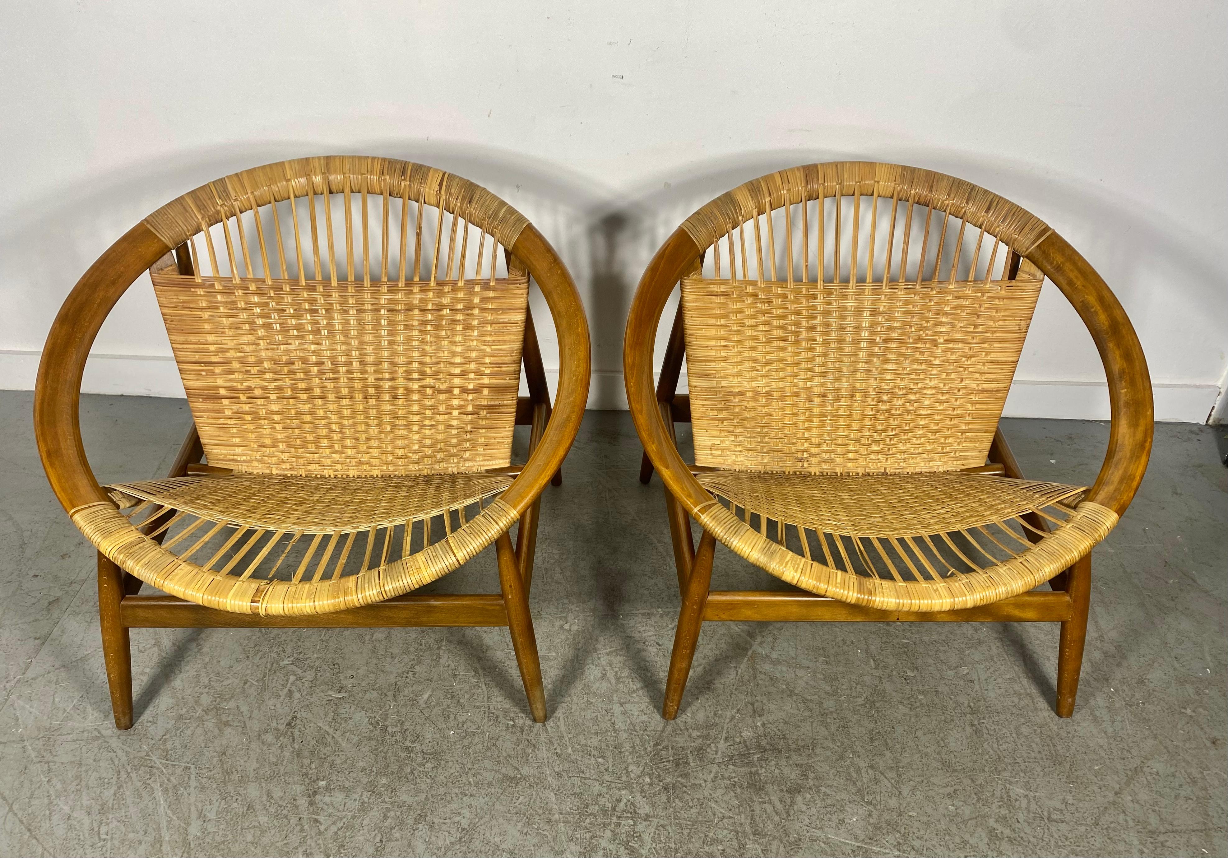 Stunning matched pair Ringstol Lounge Chair by Illum Wikkelsø,  woven wicker  seats and backs ..All original and untouched.wonderful original patina ,,finish, color,,, Red ink stamps, made in Denmark,,  Some minor wicker breaks..(see photo) .