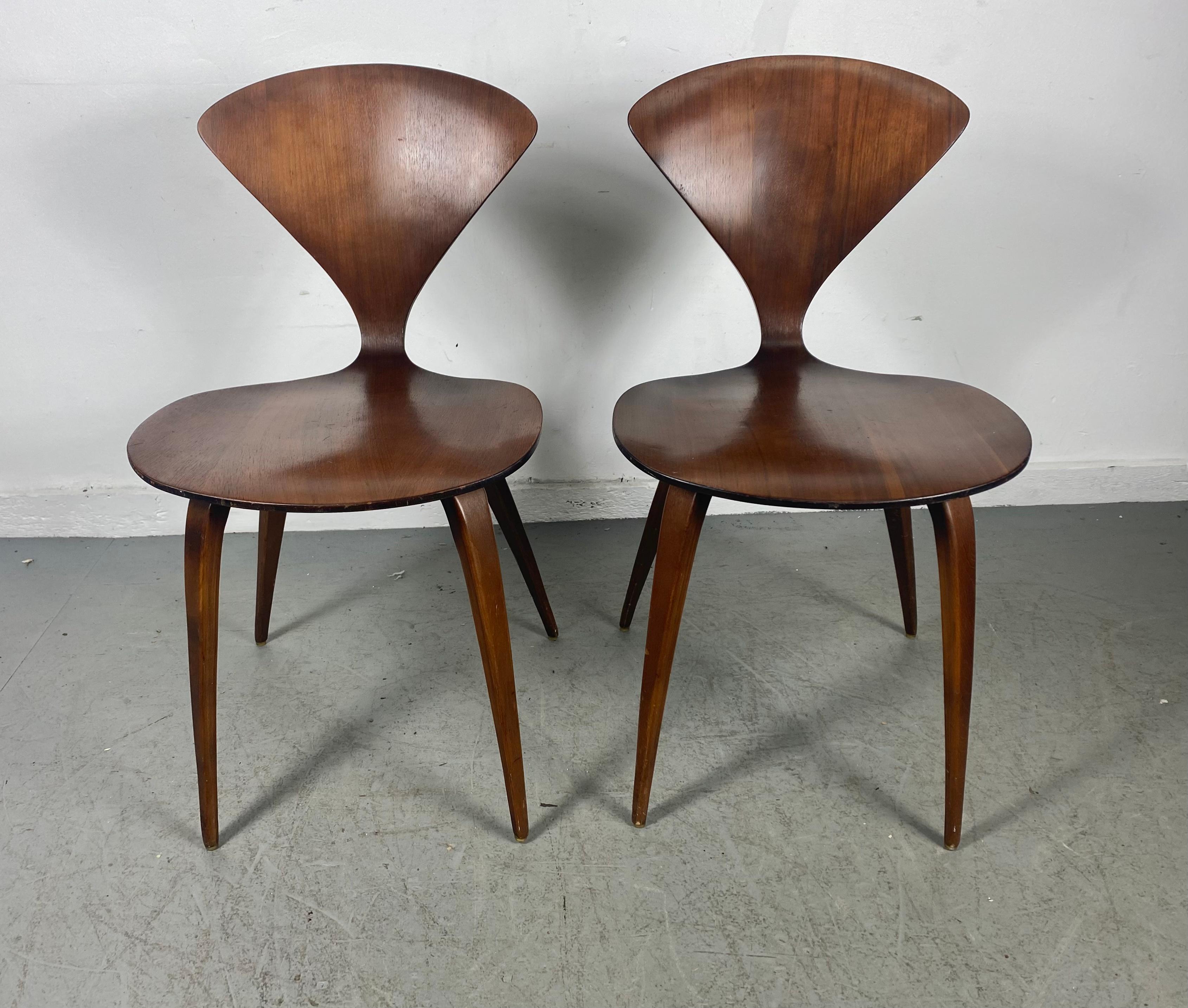 Classic Pair Modernist plywood side (dining) chairs by Norman Cherner for Plycraft, ,Stunning sculptural walnut made from steam form bent walnut plywood ,,c.1950. .Nice original condition,, Wonderful patina..