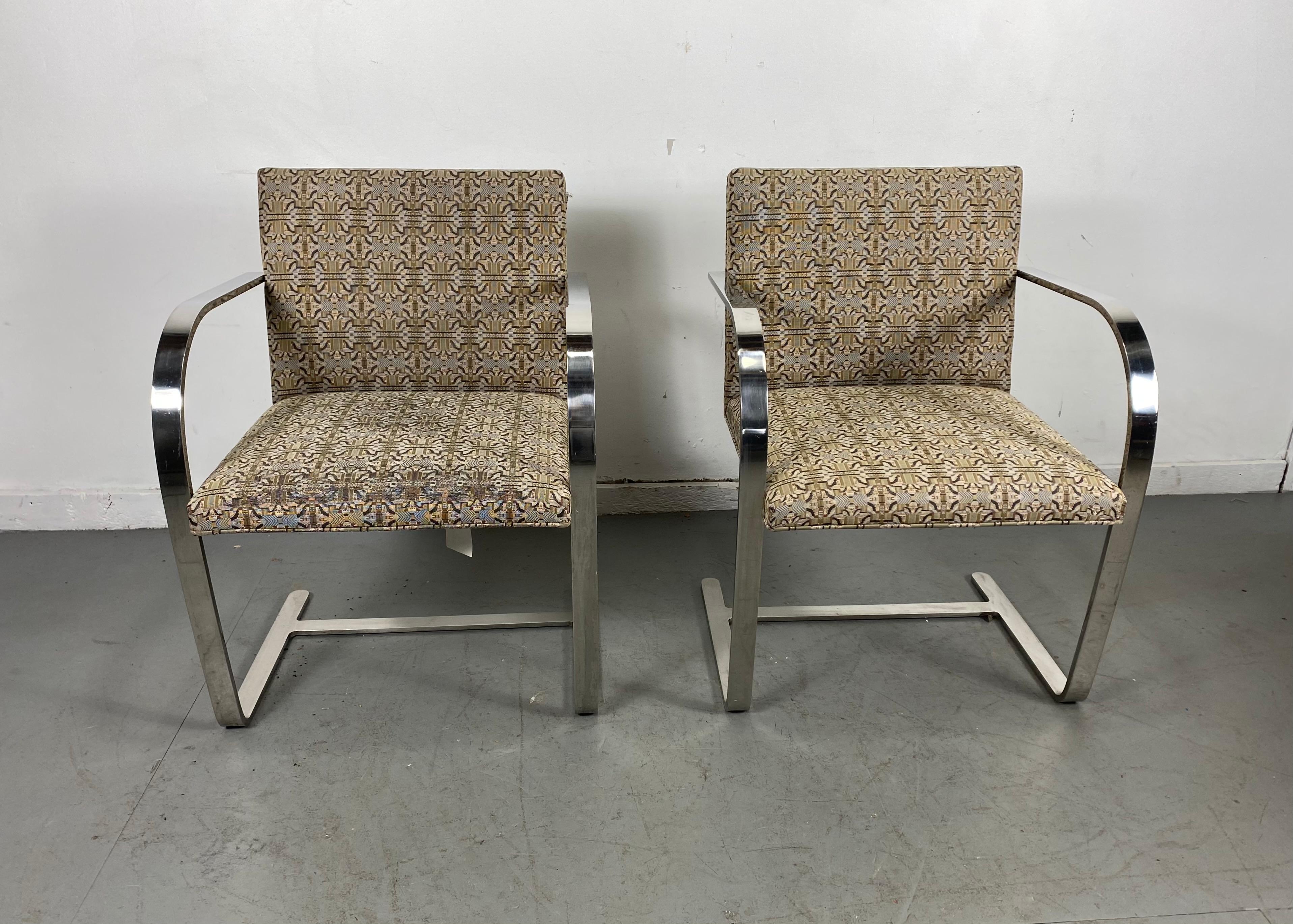 Matching pair of Brno chairs designed by Mies Van Der Rohe for Knoll, flat bar steel frames, stunning custom order fabric, one chair minor wear, retain original Knoll labels.
