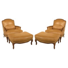 Classic Pair of French Louis XV Style Leather Bergères with Ottomans