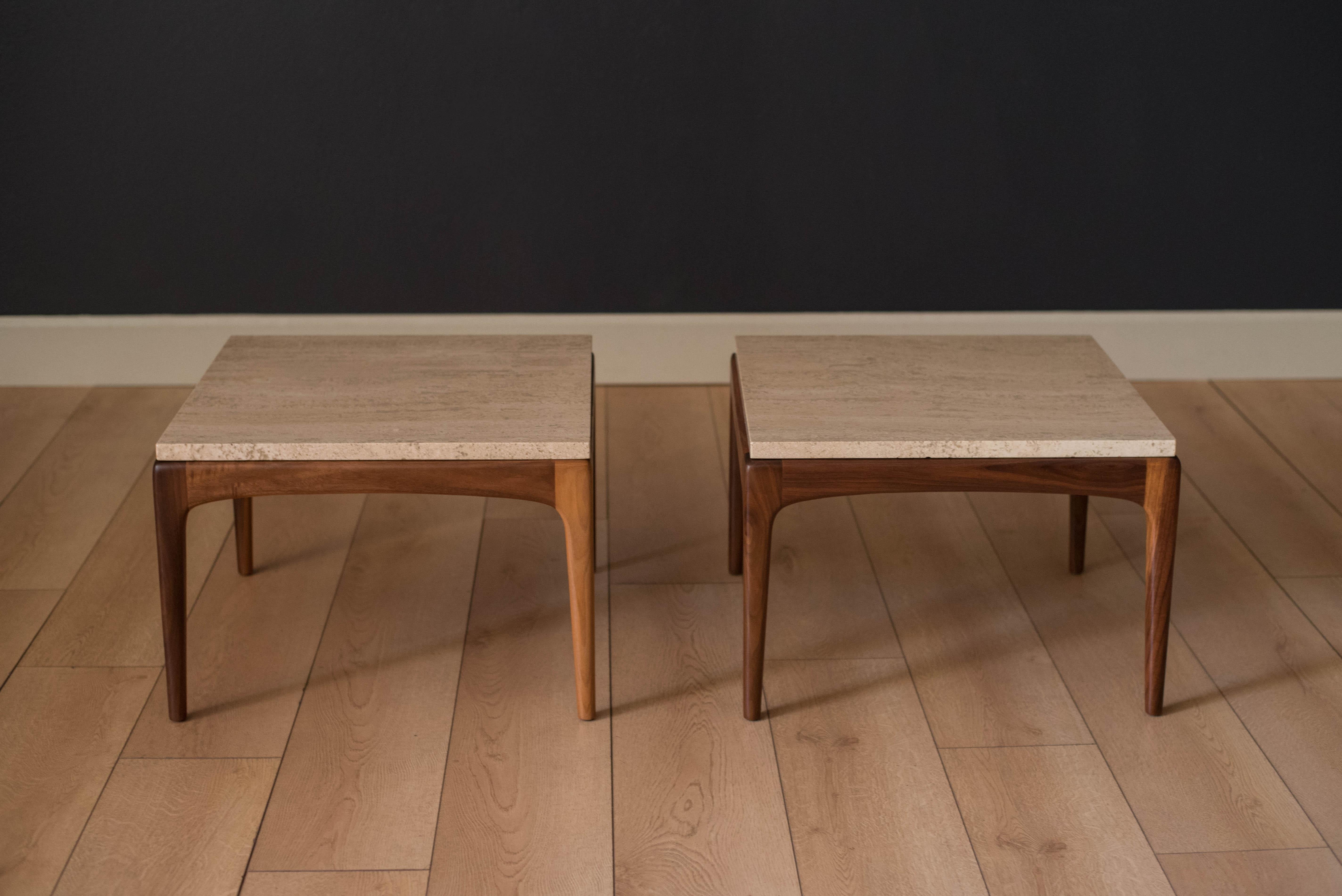 Mid century pair of square framed walnut side tables made by Lane Furniture Co., circa 1960s. Travertine tops display a cream and beige natural finish. 

Travertine: 7/8
