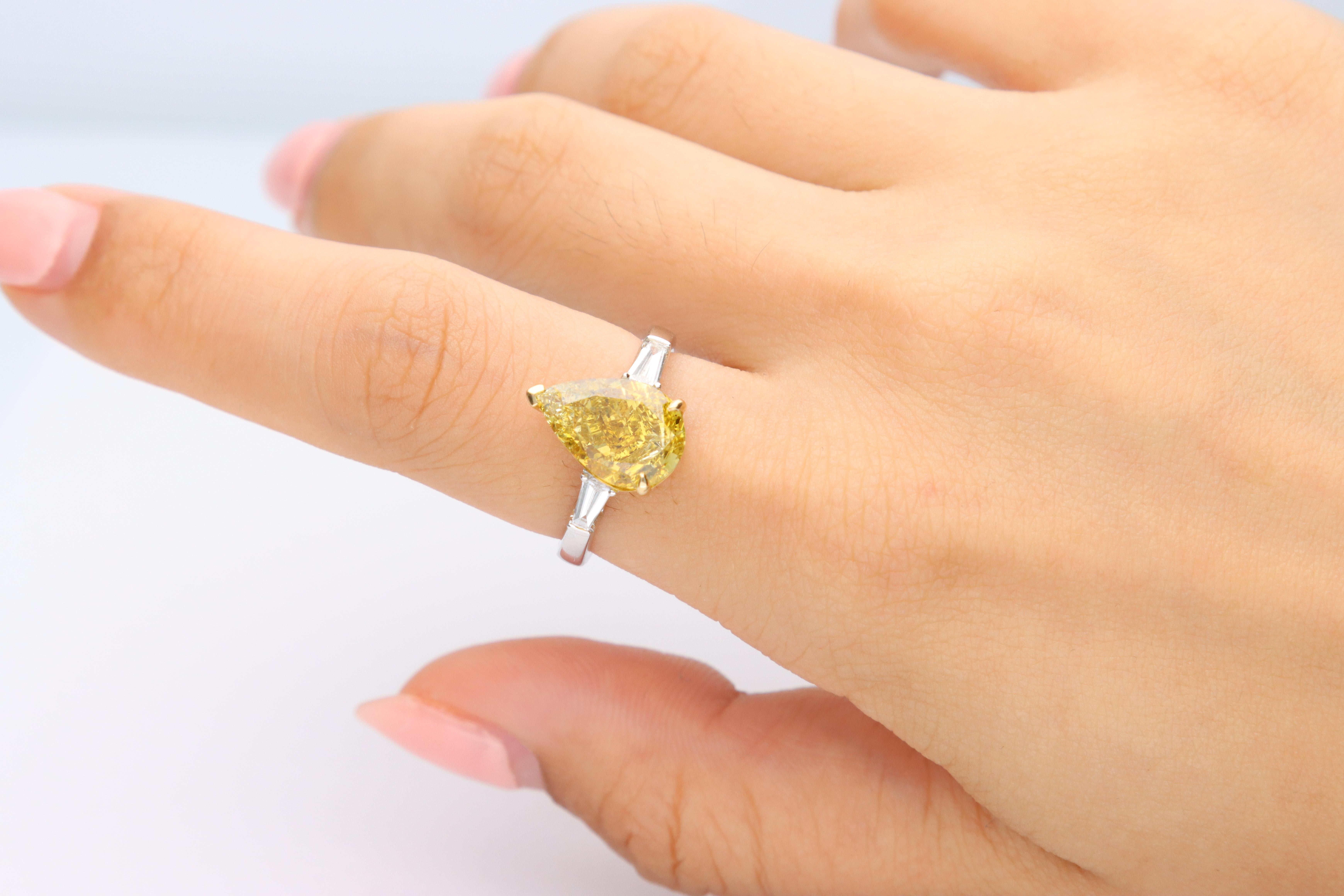 Stunning, timeless and classy eternity Unique Ring. Decorate yourself in luxury with this Gin & Grace Ring. The 18K Two Tone Gold jewelry boasts with Pear-cut 1 pcs  5.02 carat, Natural Baguette-cut white Diamond (2 Pcs) 0.22 Carat accent stones for