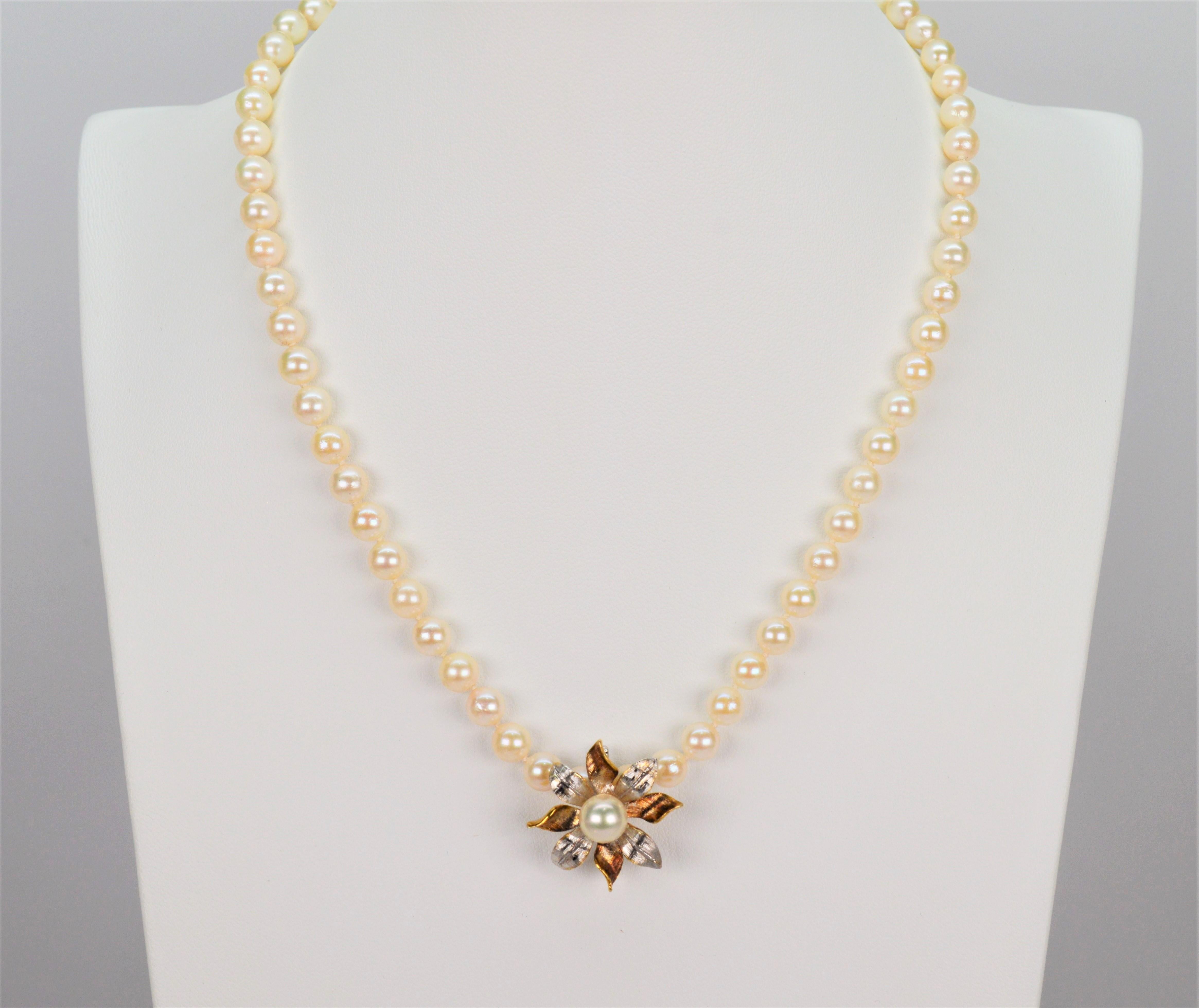 Elevate from traditional to terrific by adding this bright floral burst enhancer in 14 karat white and yellow gold to this necklace. Includes a new 16 inch pearl necklace of round AA 5mm round Akoya Pearls that can be worn independently as a classic