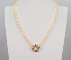 Classic Pearl Strand with 14 Karat Gold Vintage Floral Burst Enhancer
