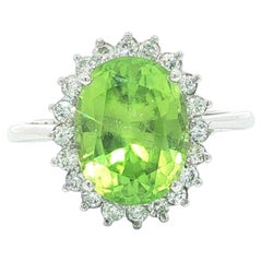 Classic Platinum 4.68ctw GIA Oval Yellowish Green Peridot & Diamond Halo Ring