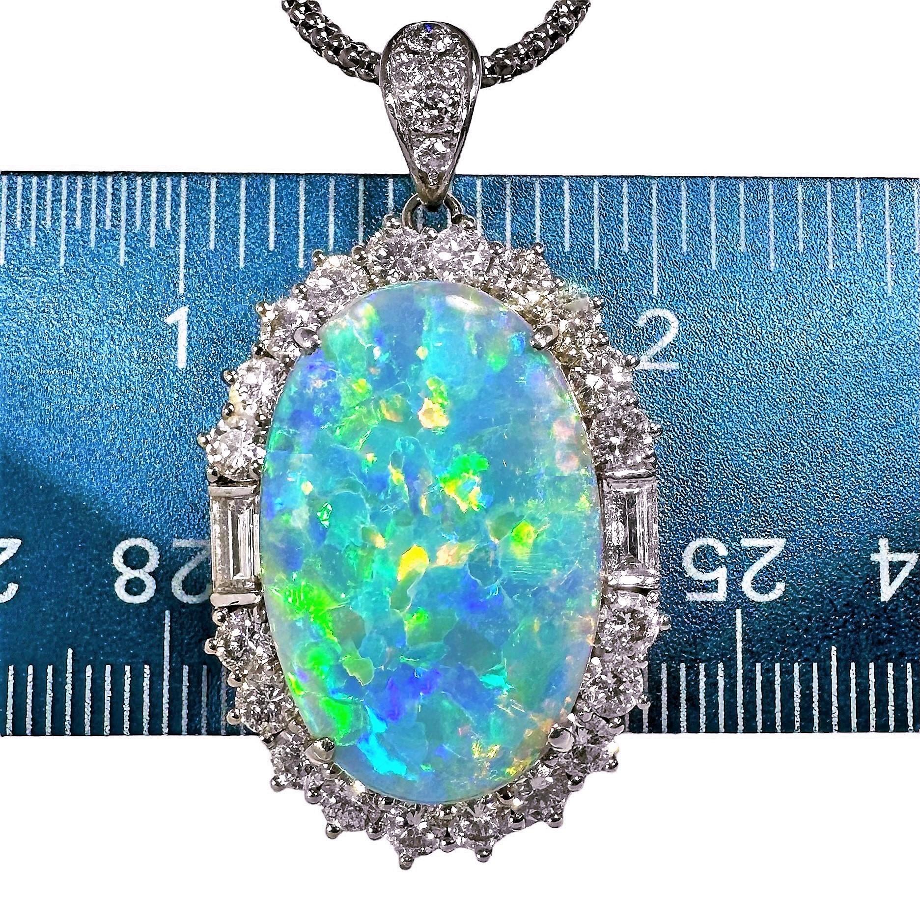 This elegant platinum pendant is done in truly classic style. The center 15.09CT grey opal is surrounded by 20 round brilliant cut and two straight baguette diamonds, having a 3.00ct total approximate weight of overall G/H color and VS1 clarity. The