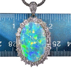 Classic Platinum Pendant with Opal Center Surrounded by Diamonds