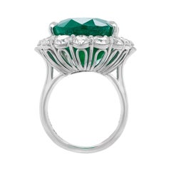 Classic Platinum Ring with Green Emerald & Round Diamonds