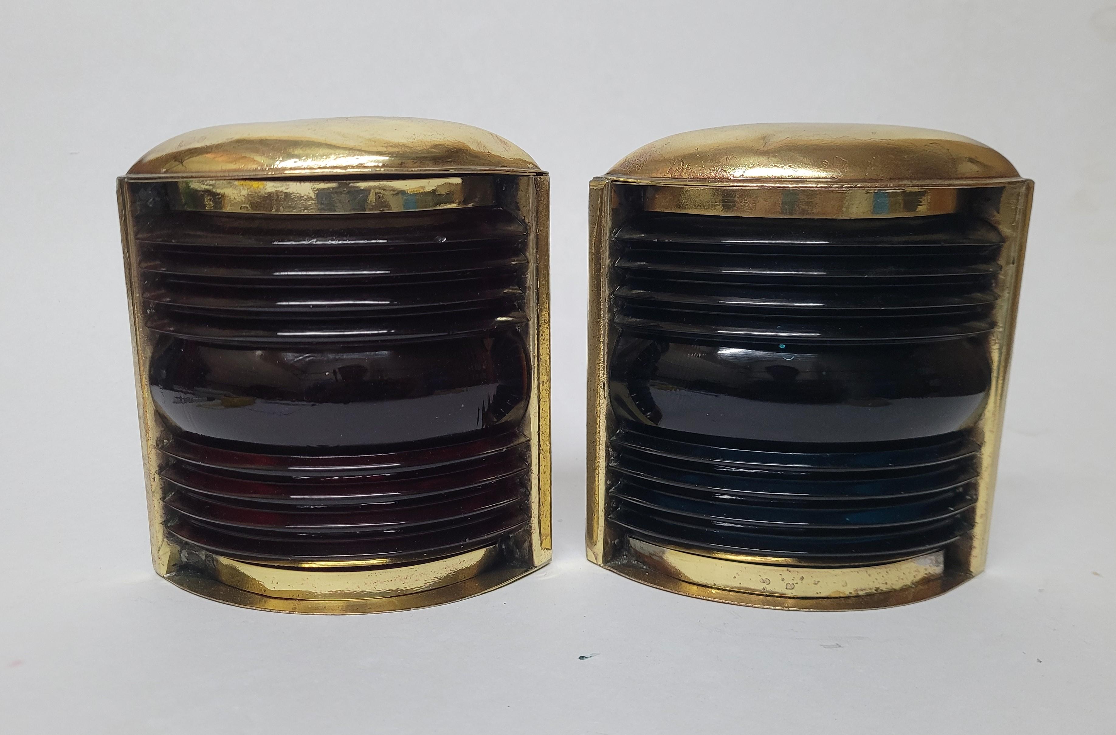 Highly polished solid brass boat lanterns with fresnel glass lenses. Rich blue and red in color. Circa 1950

Weight: 2 lbs
Overall Dimensions: 6