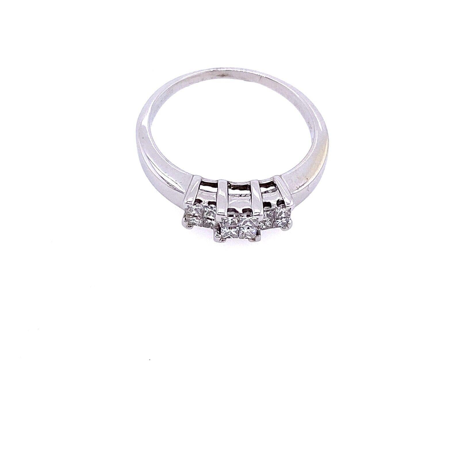 This trilogy ring features a cluster of 12 natural princess cut Diamonds in a classic setting, a stunning design that symbolizes love and friendship. The 0.50ct total Diamond weight shines with brilliance.

Additional Information: 
Total Diamond