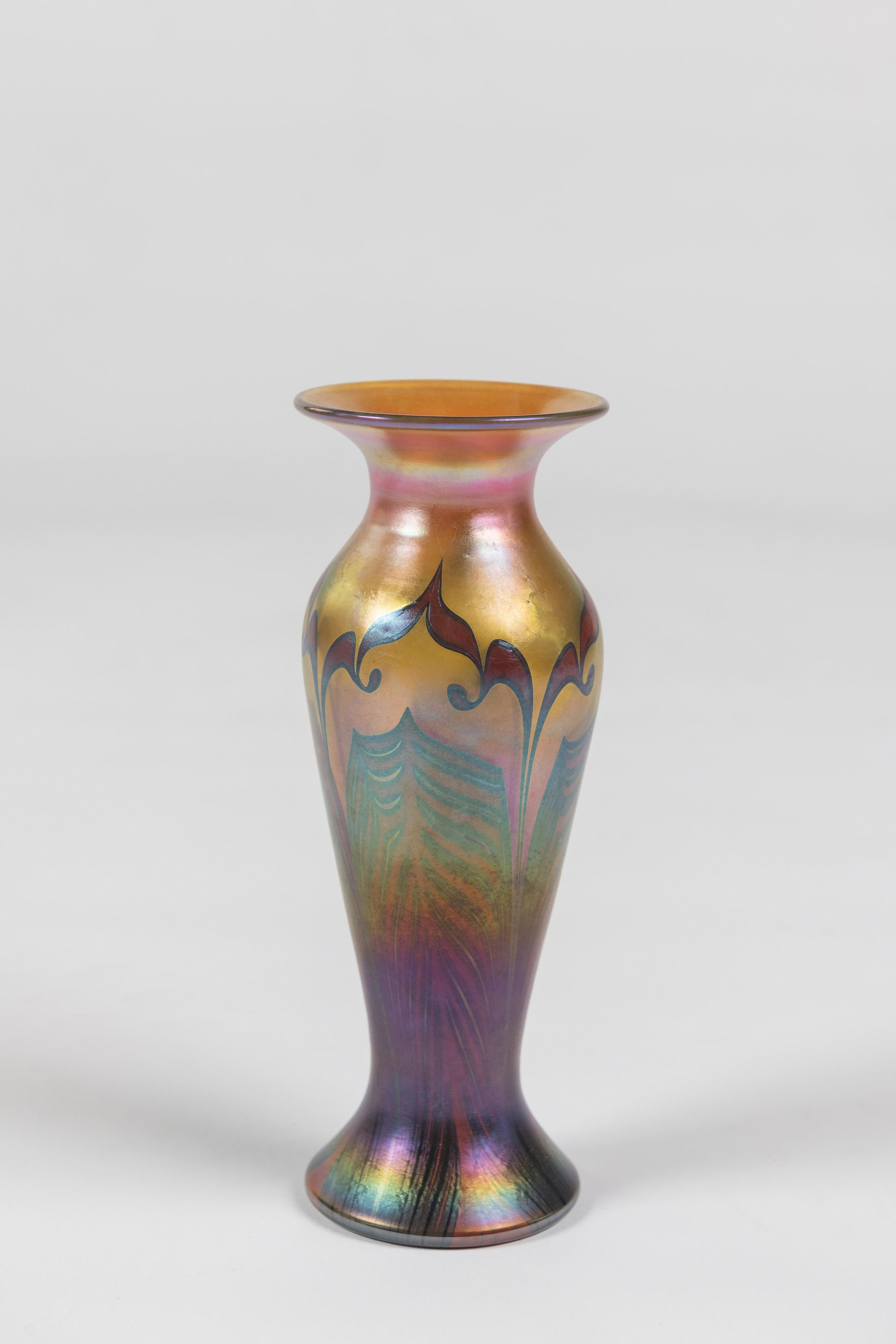 Popular classic pulled feather design art glass vase, made by Lundberg Studios of California, signed. Iridescent finish and inspired by Tiffany designs.