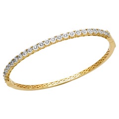 Brazalete de tenis redondo clásico con diamantes tallados en oro amarillo de 14 quilates