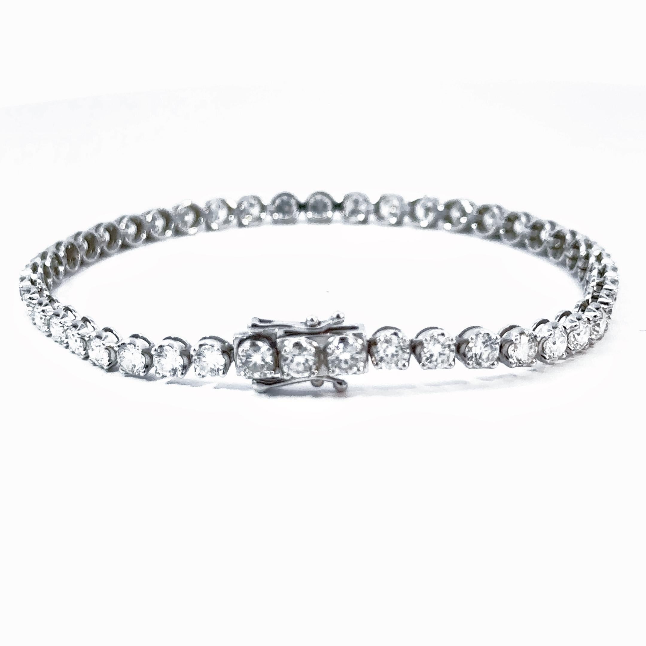 Modern and elegant, this diamond bracelet is part of Xuelai Jewellery London classic lines collection. Composed of a single row of ethically sourced round brilliant diamonds, their combined weight totals 4.32 carats. Each diamond is prong-set in 18k