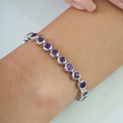 Bracciale tennis in linea con ametista dal classico taglio rotondo, in argento sterling, firmato Silvorra
