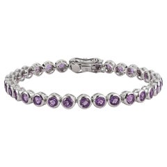 Bracciale tennis in linea con ametista dal classico taglio rotondo, in argento sterling, firmato Silvorra