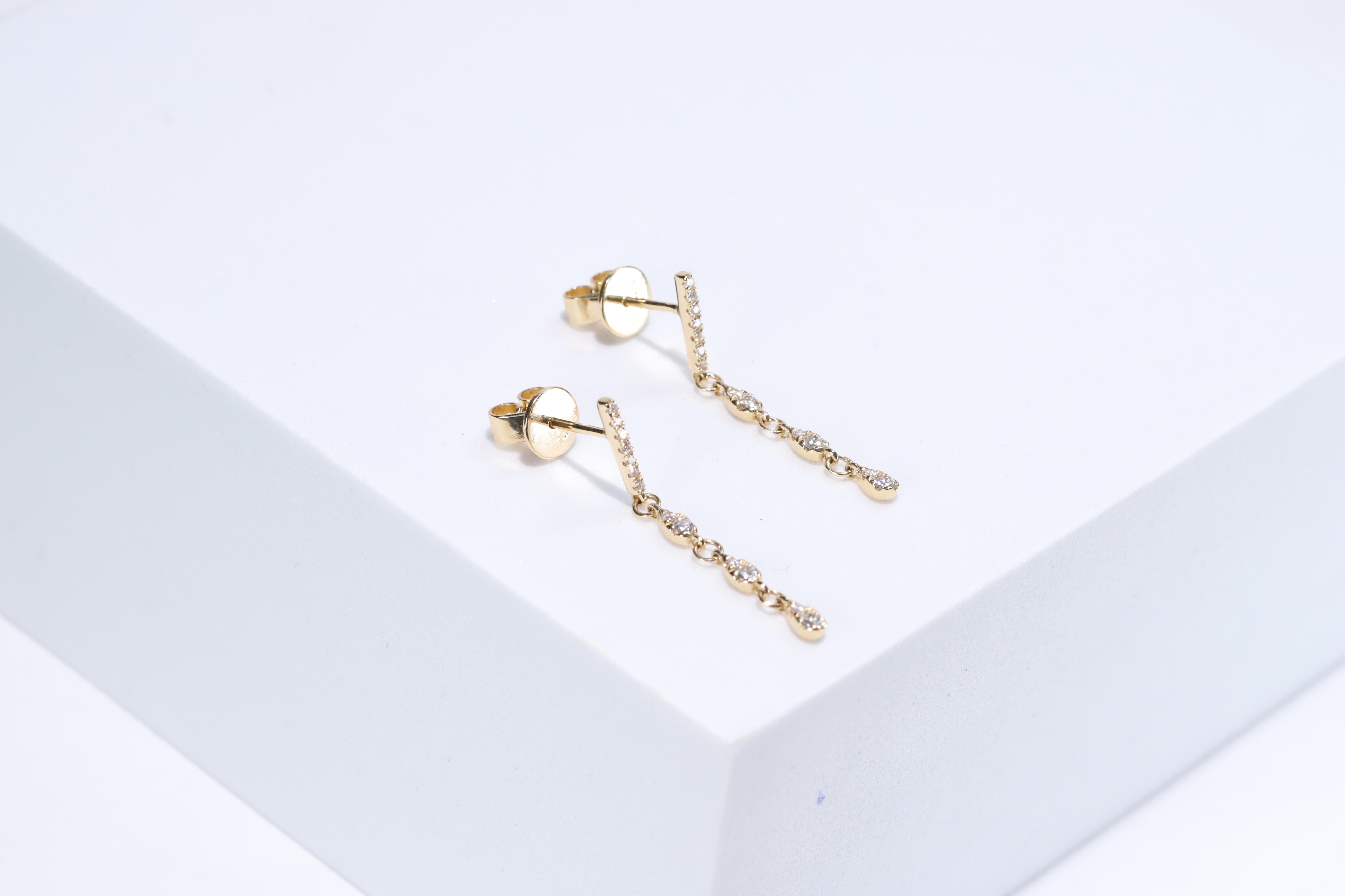 Each of these pretty earrings from Gin & Grace features a with white diamonds. These earrings are made of rich 14-karat Yellow gold with a high polish. Style: Dangle, Diamonds: 26 pcs Diamond cut: Round Diamond weight: 0.20 carat Color: G-H Clarity: