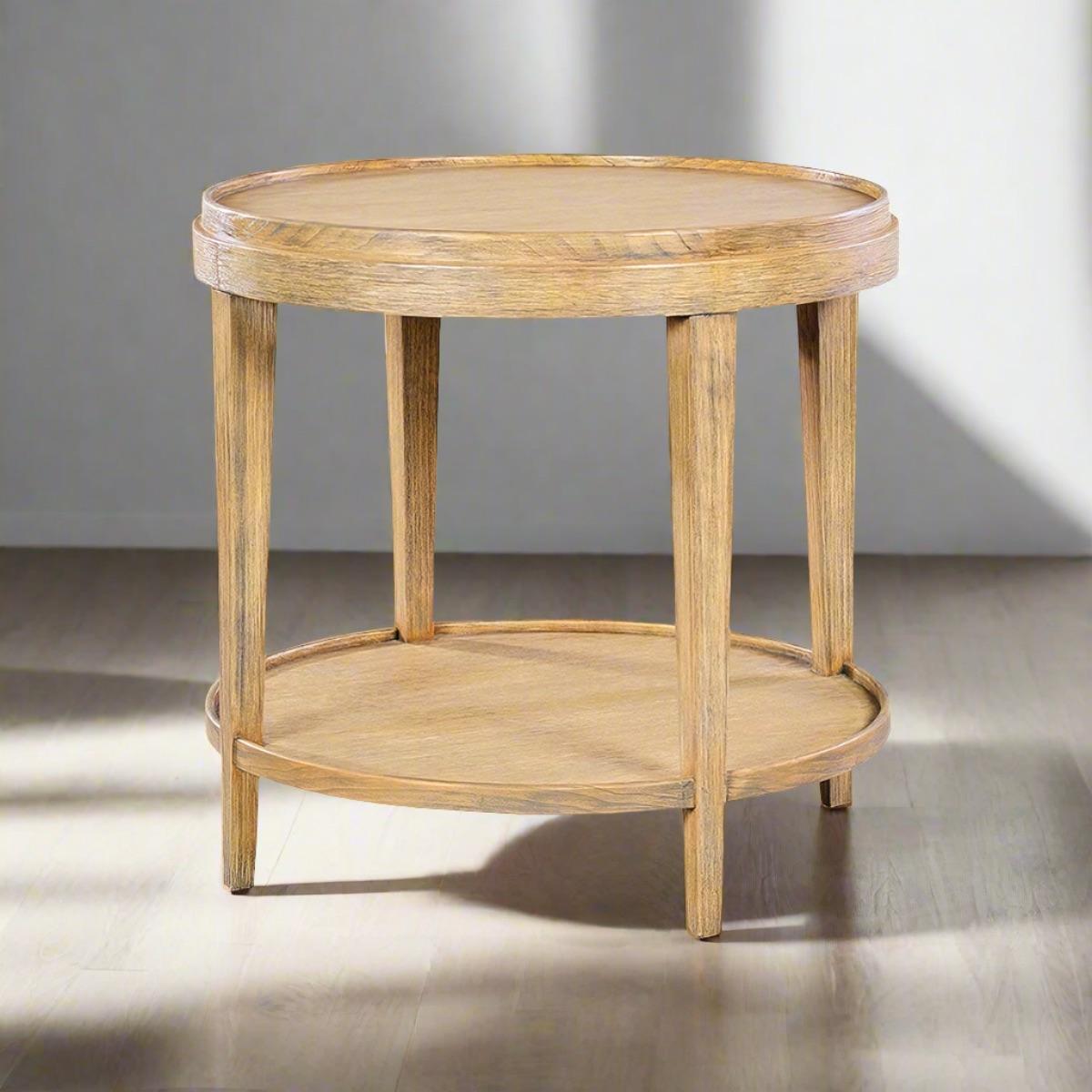 A round end table with our unusual light rabbit finish on Celtids veneer and solids. The two-tier side table with a wooden galleried dish top, with square tapered legs and a round shelf stretcher base.

Dimensions: 27