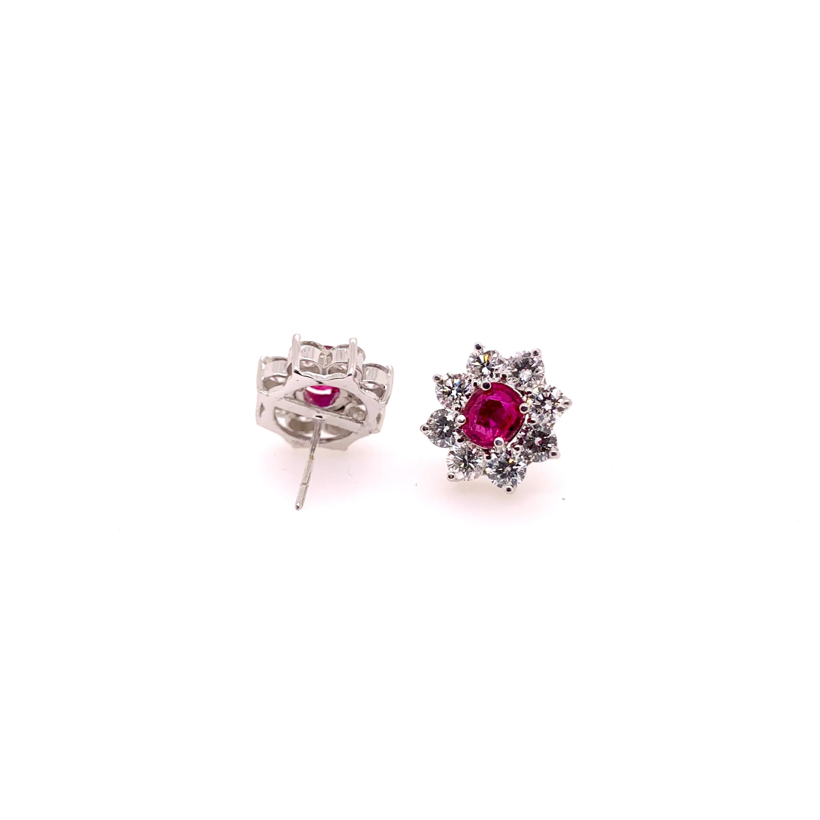 This iconic floral style ruby and diamond earrings are a must have in anyone's jewelry collection.  The rubies are well matched with it's stunning red rose hues and has generous size round brilliants that surround them.  This ultimate classic