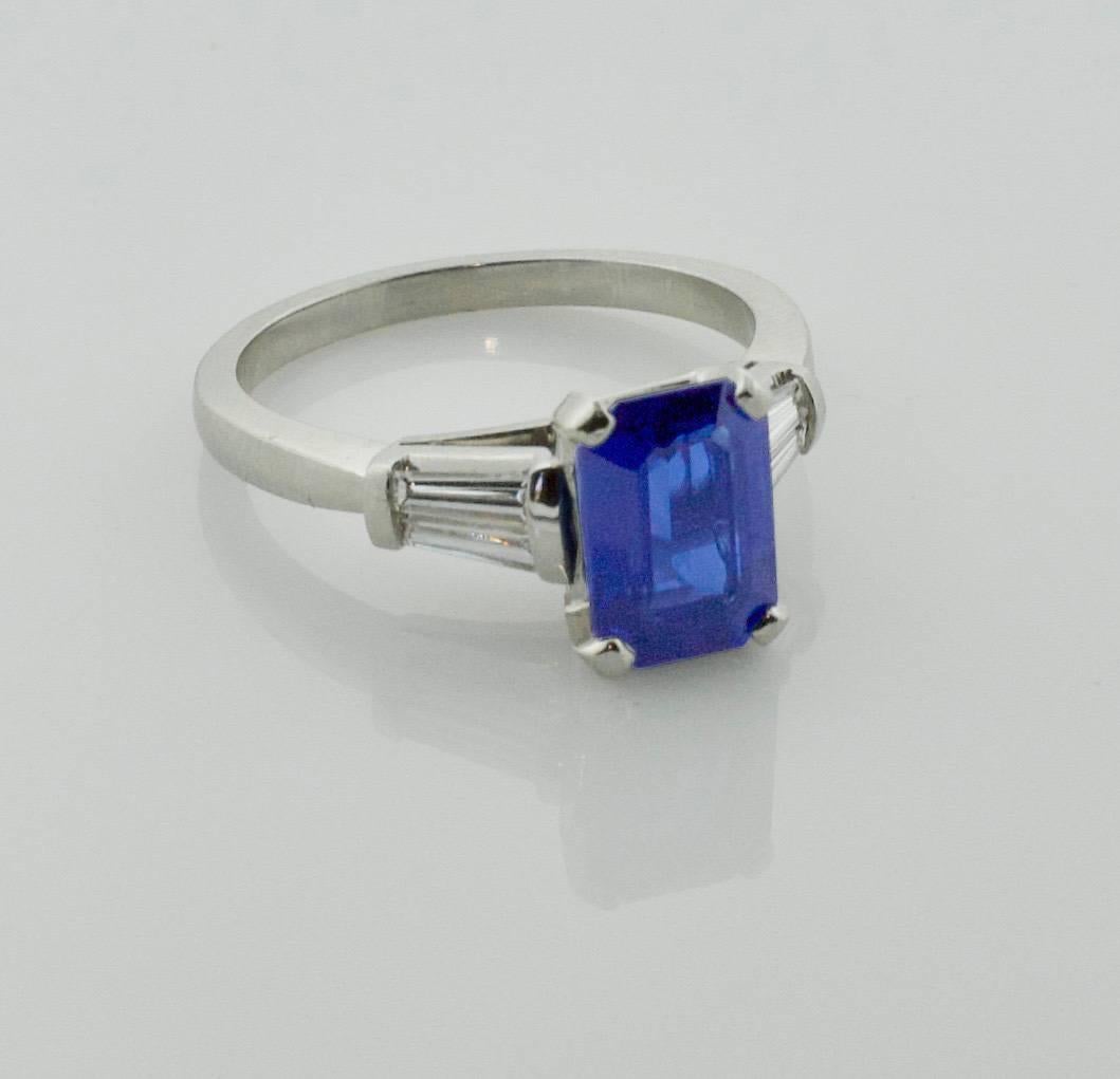 Classic Sapphire and Diamond Ring in Platinum
One Emerald Cut Sapphire weighing 2.35 carats approximately
Four Tapered Baguette Cut Diamonds weighing .40 carats approximately [GH VVS-VS]
size 6 1/2 
