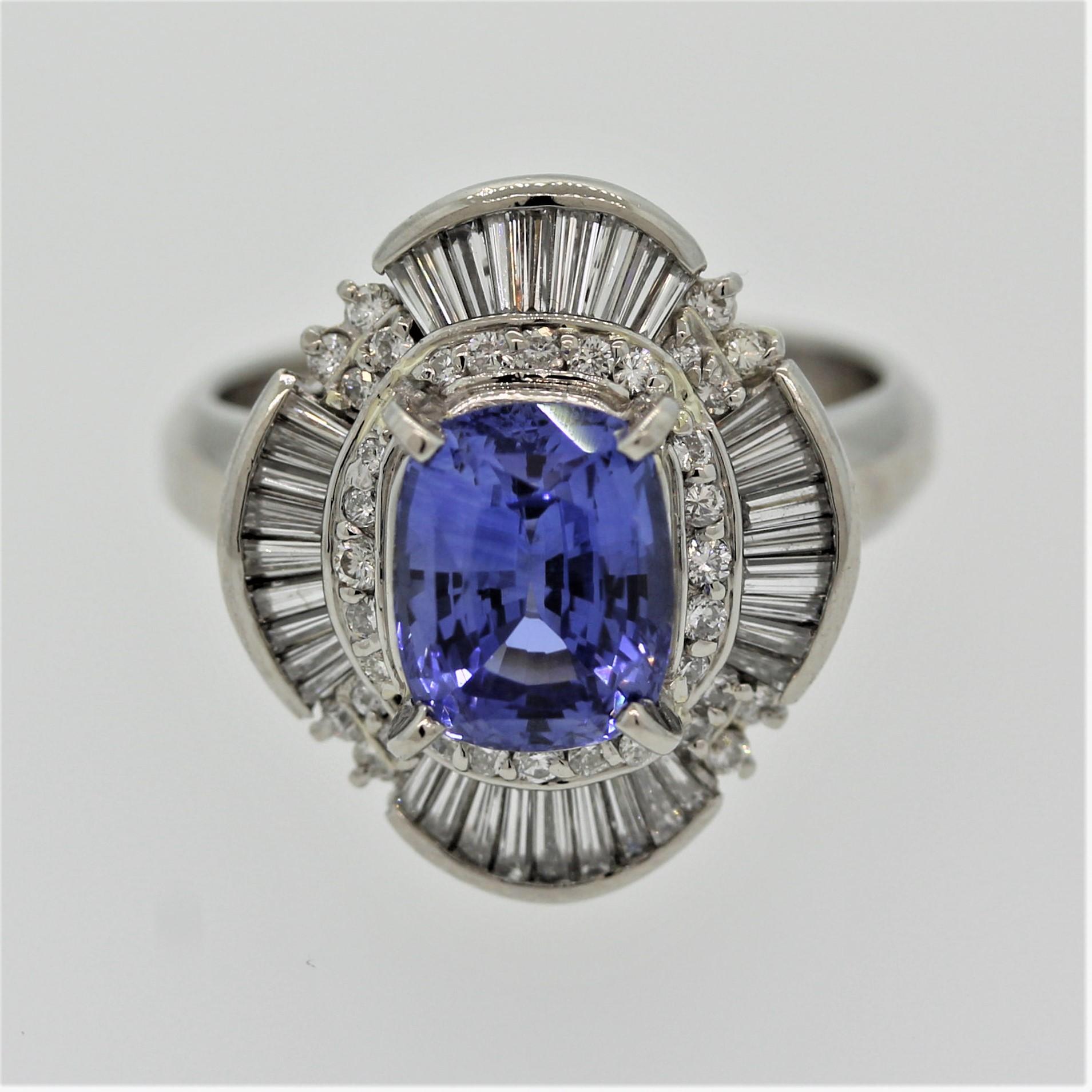 A wonderfully bright and lively sapphire takes center stage. It weighs 2.60 carats and has a clean brilliant blue color typical of fine stones from Ceylon (Sri Lanka). It is accented by 0.82 carats of round brilliant and baguette cut diamonds in a