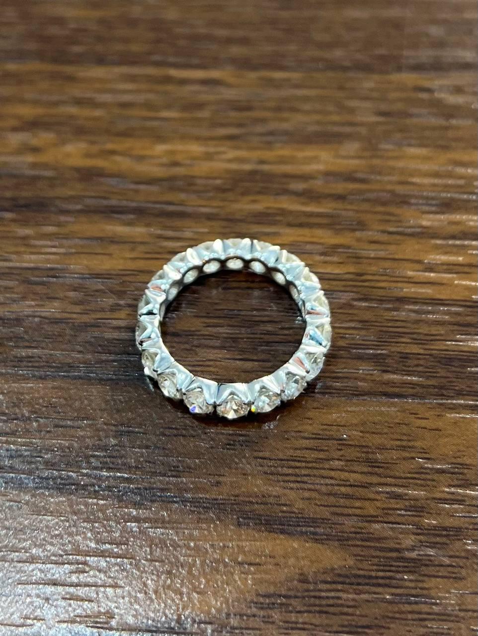 A seamless circle of brilliance. This striking 18K white gold ring features a continuous band of sparkling round-cut Diamonds (2.72 ct). Each diamond is meticulously set to create an unbroken line of shimmer, encircling the finger with elegance. The
