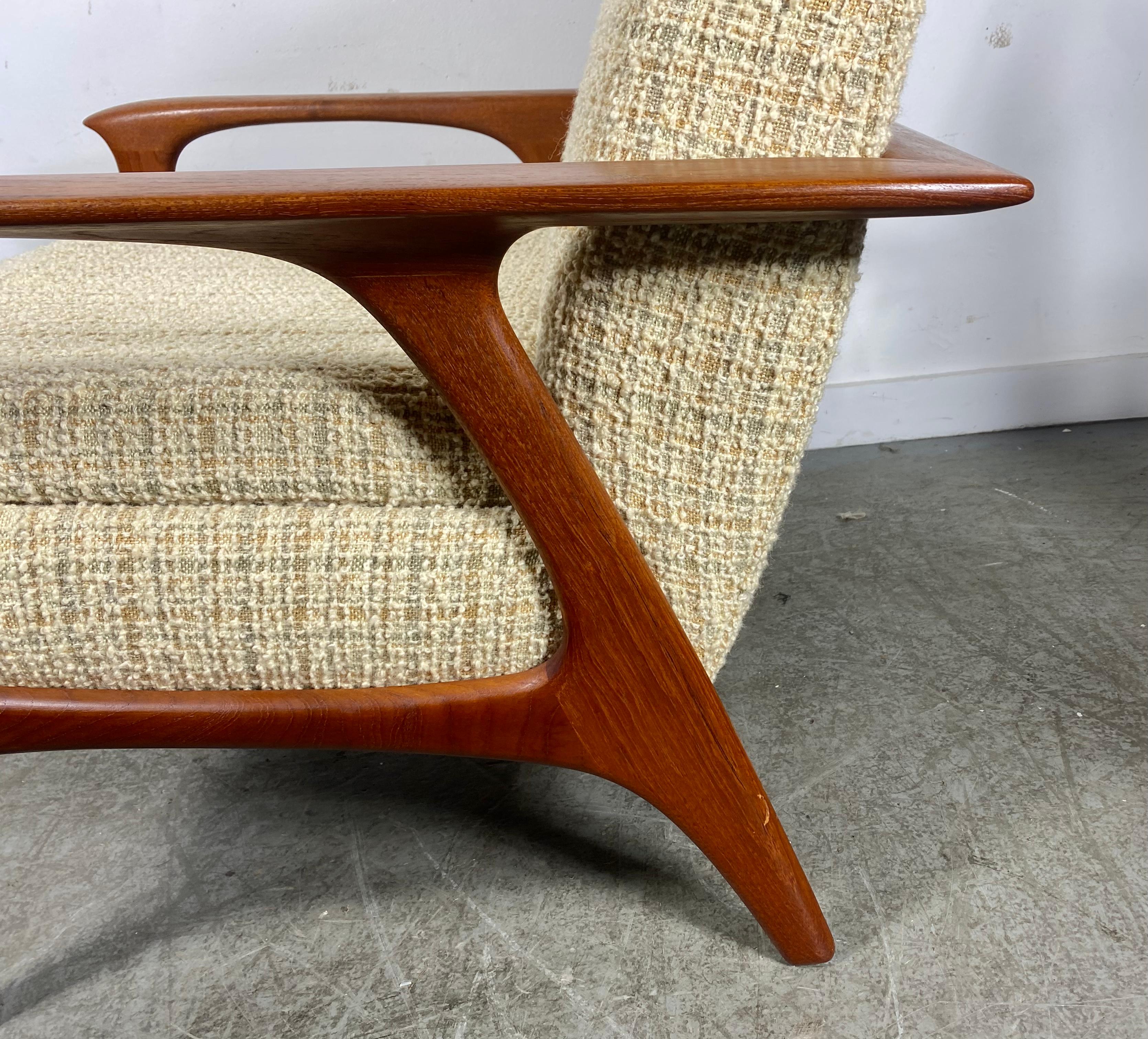Classic Scandinavian Modern Teak Lounge Chair , manner Of Hans Wegner. Superior quality and construction.Classic ,sleek deign. Retains original cream color wool fabric upholstery in excellent original condition. interior seat cushion just starting