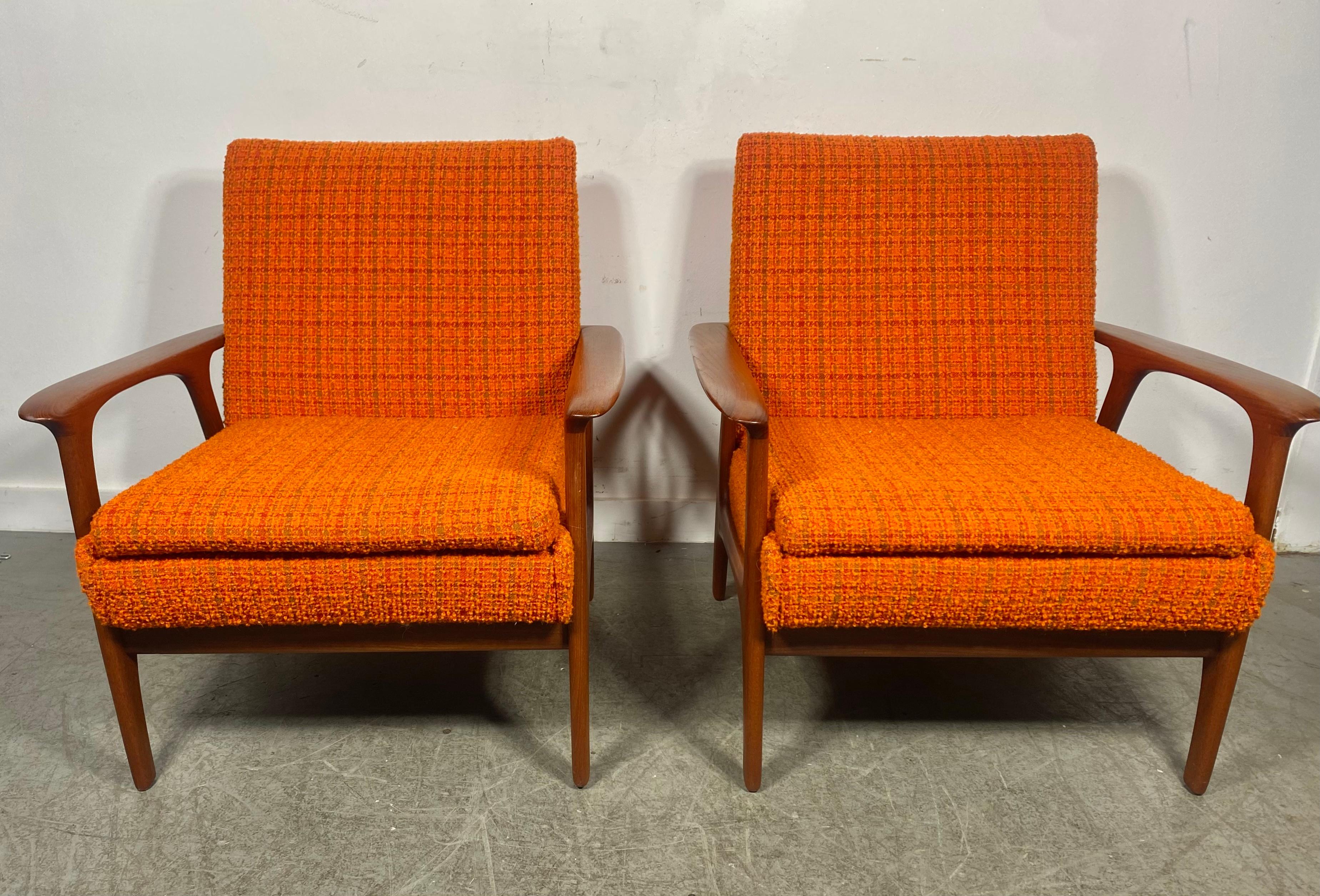 Classic PAIR Scandinavian Modern Teak Lounge Chairs , manner Of Hans Wegner. Superior quality and construction.Classic ,sleek deign. Retains original orange color wool fabric upholstery in excellent original condition. interior seat cushions just