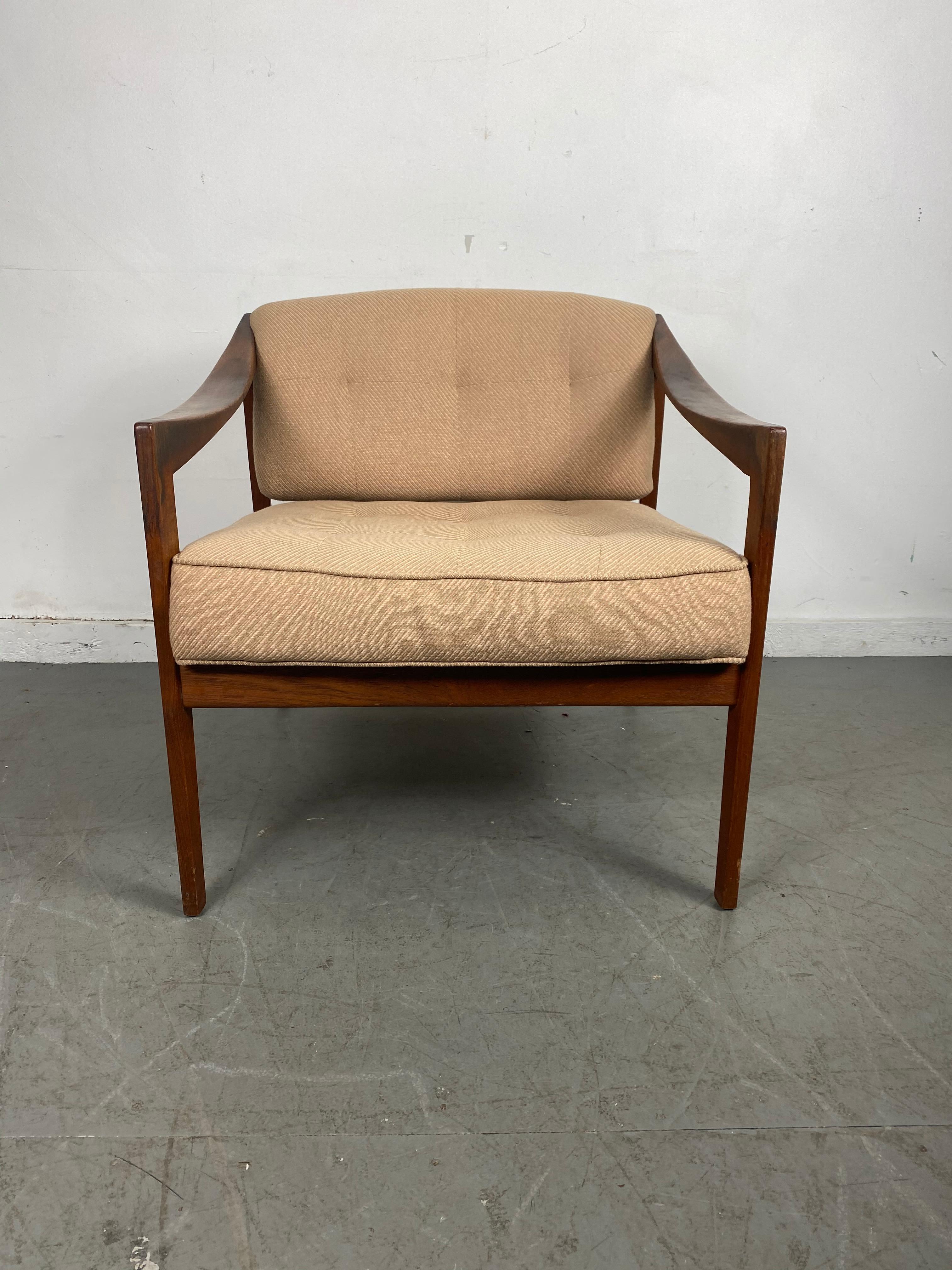 Classic Scandinavian Modern walnut lounge chair by DUX / Sweden, amazing sculptural walnut curved arms, superior quality and construction, retains original upholstery, nice original condition. Extremely comfortable.