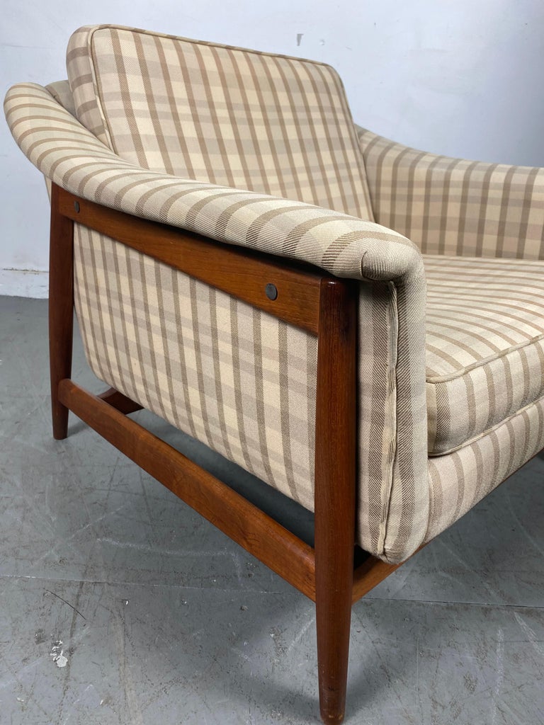 Classic Scandinavian modernist teak lounge chair by DUX / Sweden, beautiful teak wood frame, retains original upholstery, nice original condition, minor wear to piping (see photo), superior quality and construction, extremely comfortable.