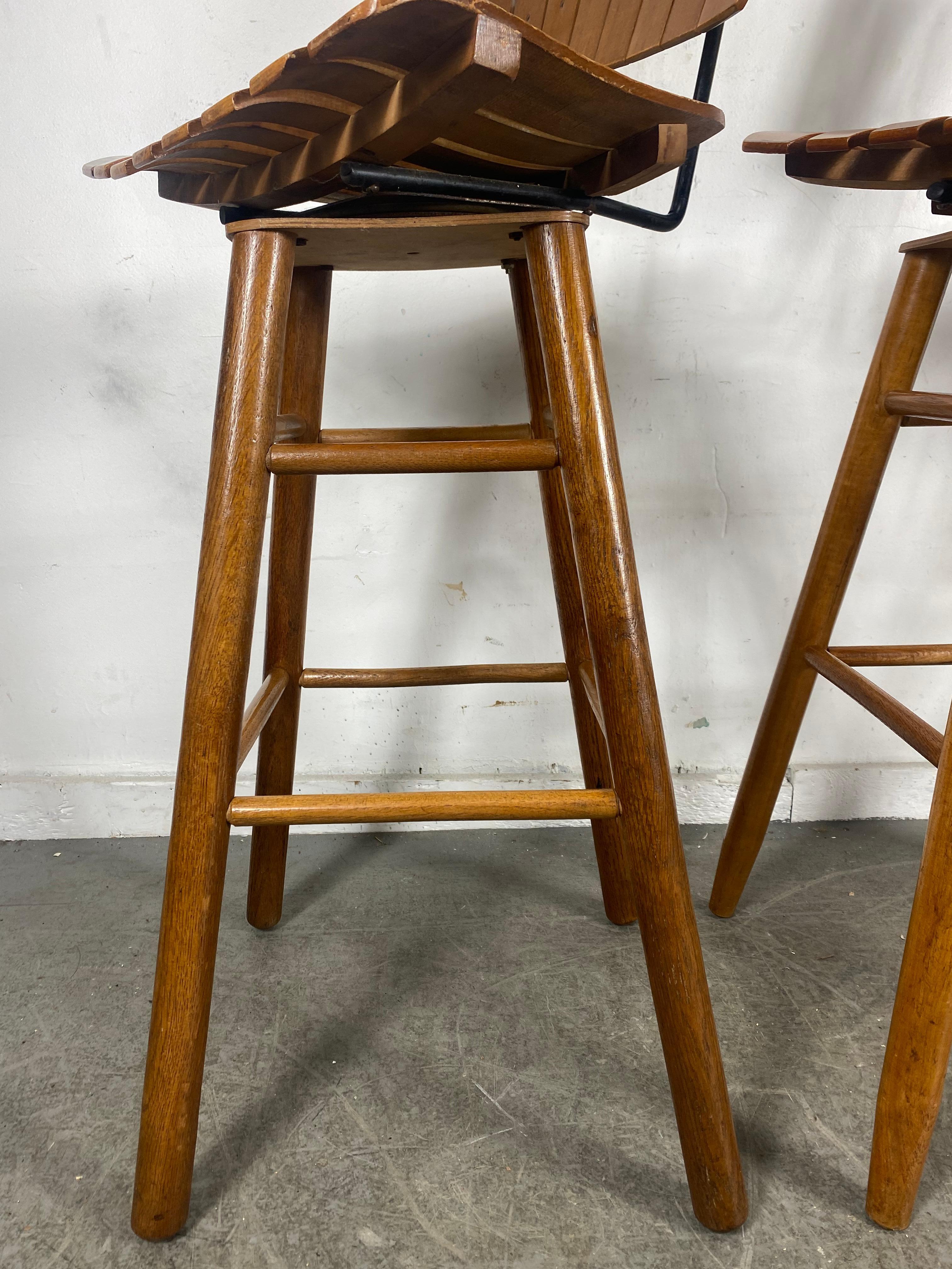 Classic set 3 Slat Wood Bar / Counter Stools designed by Arthur Uminoff 1950s In Good Condition In Buffalo, NY