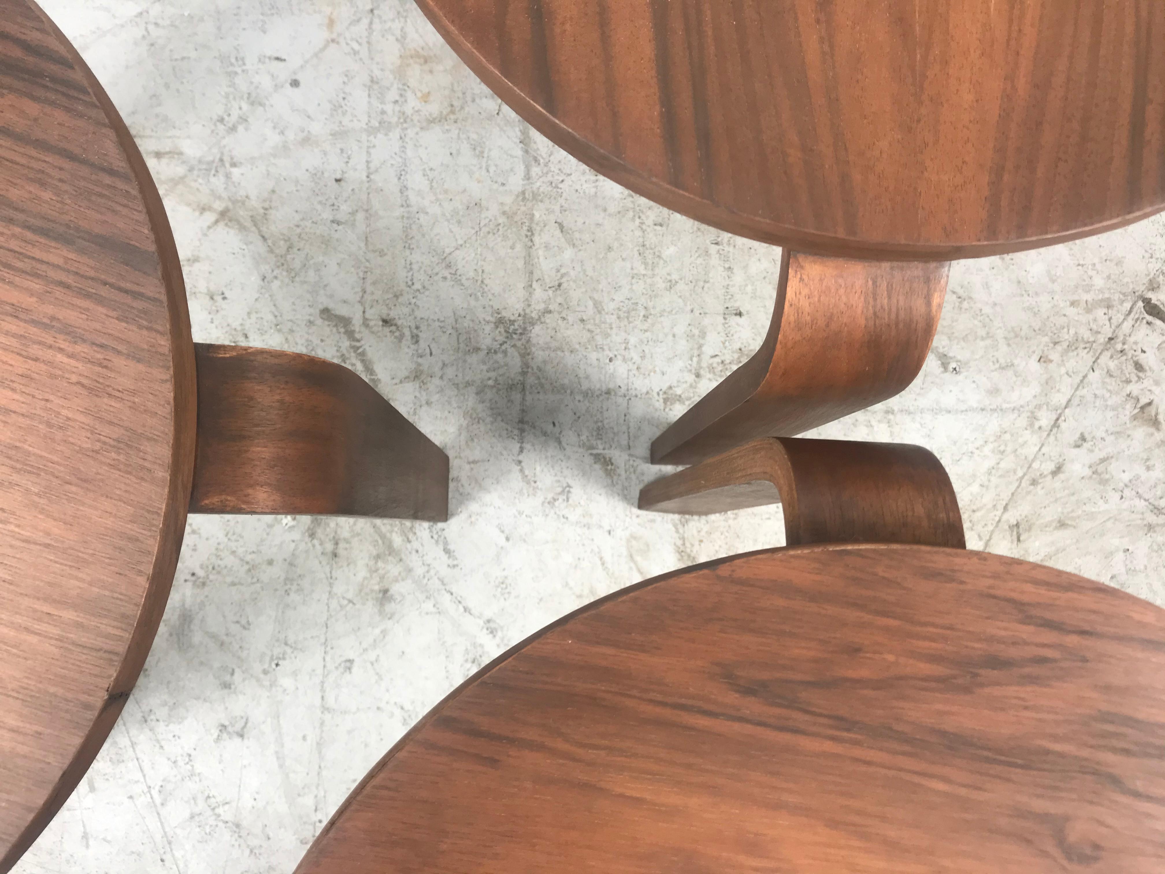 Classic set of 3 walnut stacking stools or tables manufactured by Thonet, in the style of Alvar Aalto, Three bentwood legs. Beautiful restored walnut finish, Versatile design,.
