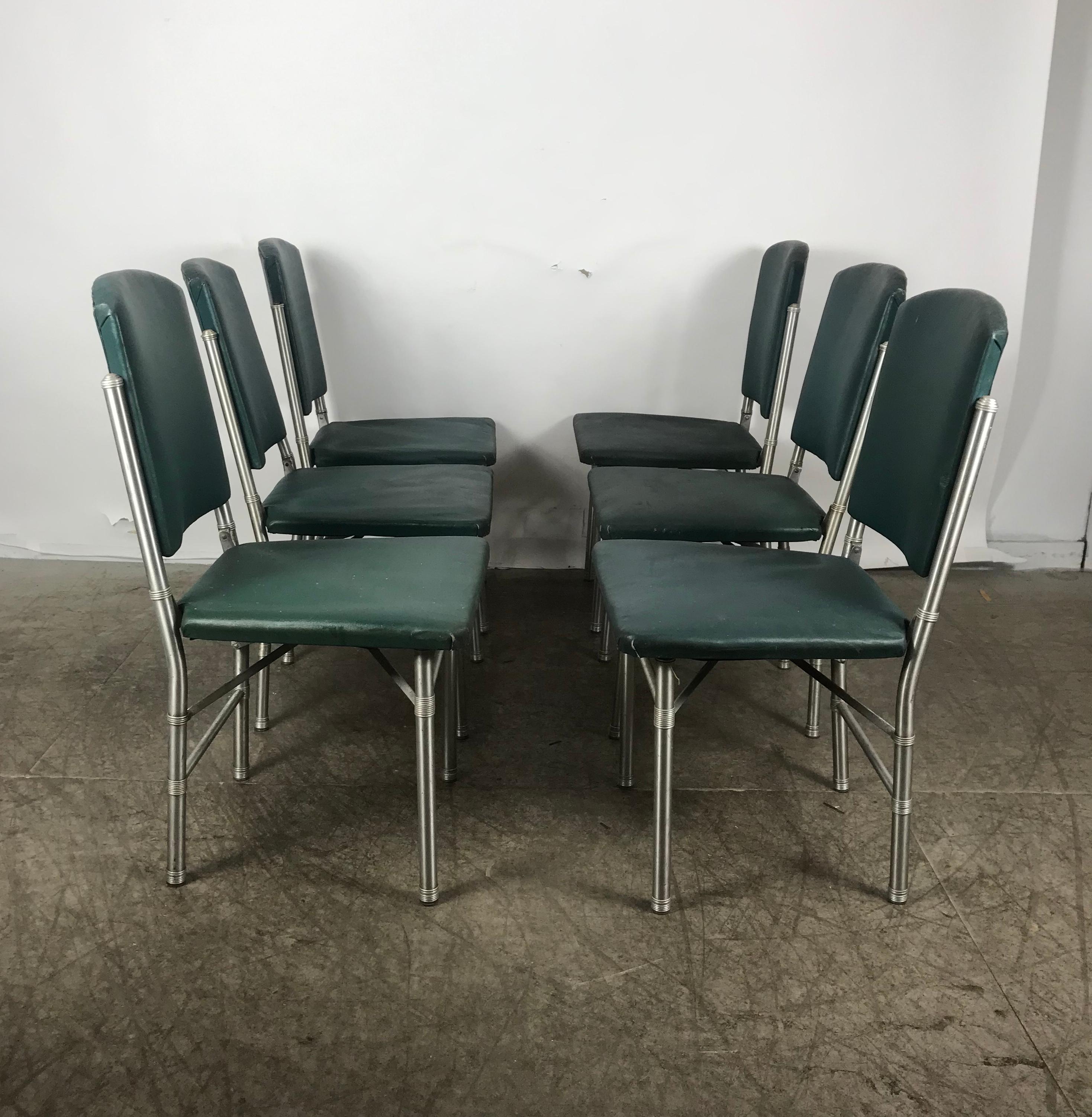 Classic set of 6 side Art Deco, Machine Age dining chairs designed by Warren McArthur.. Spun Aluminum and original oil cloth, fold for easy storage, retain original labels,.