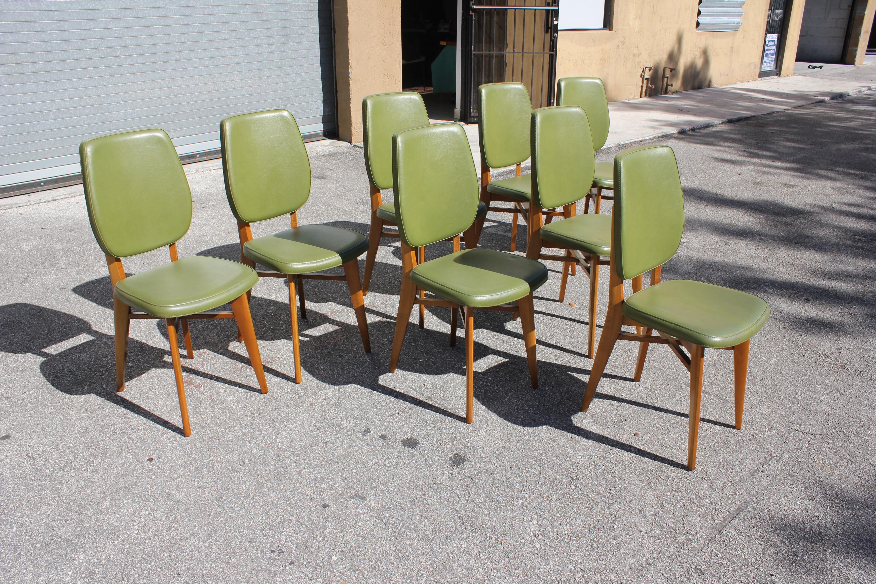 Classic set of 8 French Art Deco dining chairs solid mahogany, the chair frames are in excellent condition. (Reupholstery recommended to be change for 8 dining chairs), Green color vinyl original, we travelled to buy all our pieces in France. We
