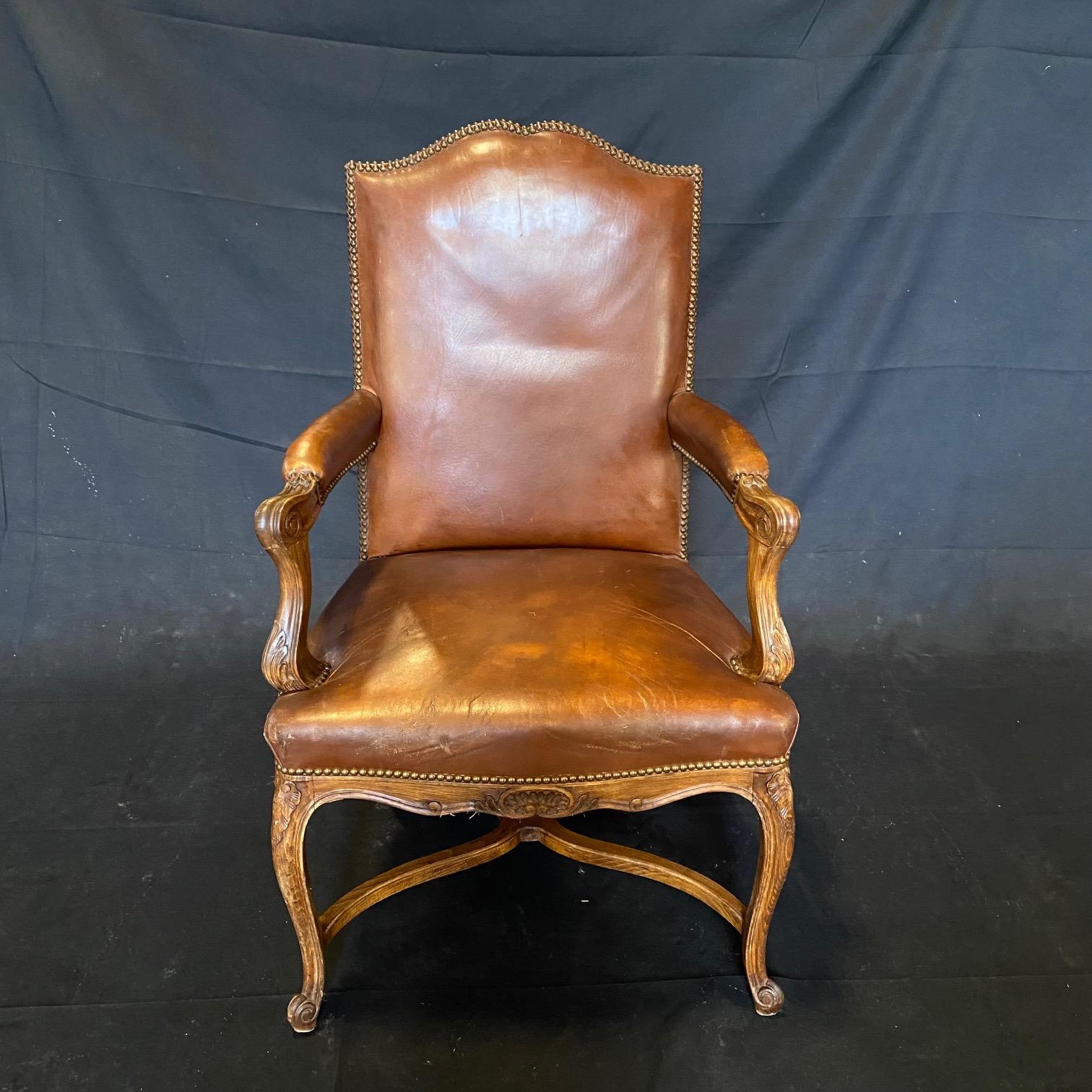 Louis XVI Classic Set of Three French Carved Wood and Leather Bergere Arm Chairs For Sale