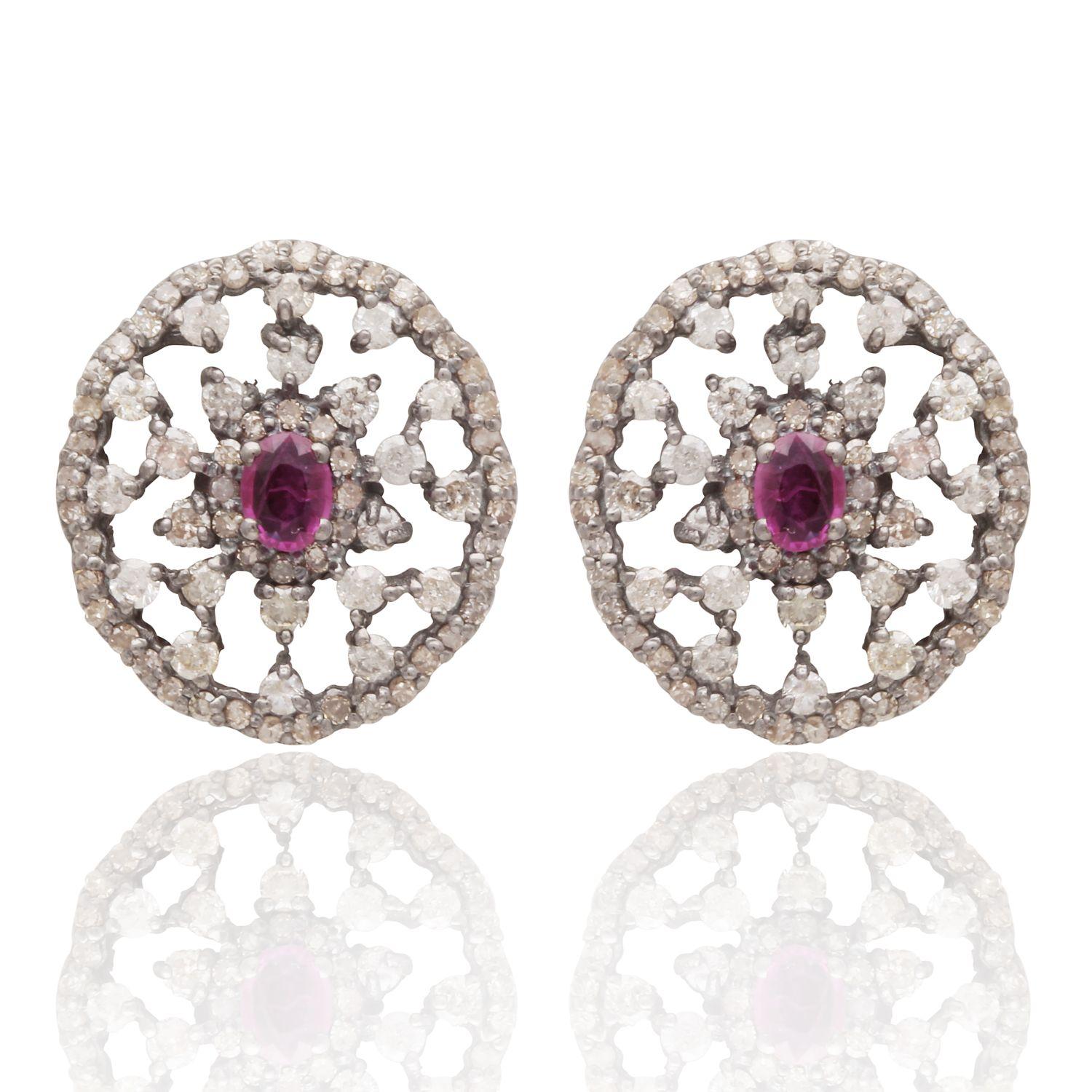 A beautifully crafted pair of mix silver and gold stud earrings with diamonds and rubies. Perfect to wear everyday or to that special occasion! Please note that the mat be slight variations in stone carat, colour and weight as each piece is handmade