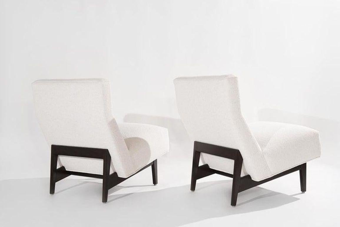 An impeccably restored pair of mid-century modern chairs, a timeless testament to design excellence. Originally conceived by the iconic Jens Risom in the 1950s, these chairs have been lovingly rejuvenated by Stamford Modern. The chairs boast a rich