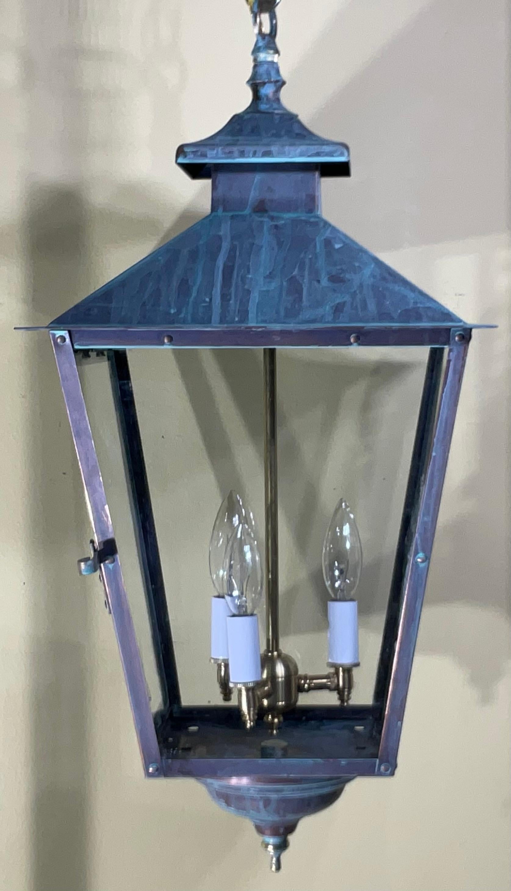 

Capture the timeless elegance of this authentic vintage lantern. Originally crafted as a classic outdoor wall-mounted sconce, this piece has been converted into a stunning ceiling hanging lantern or pendant light. Featuring a rich, naturally aged