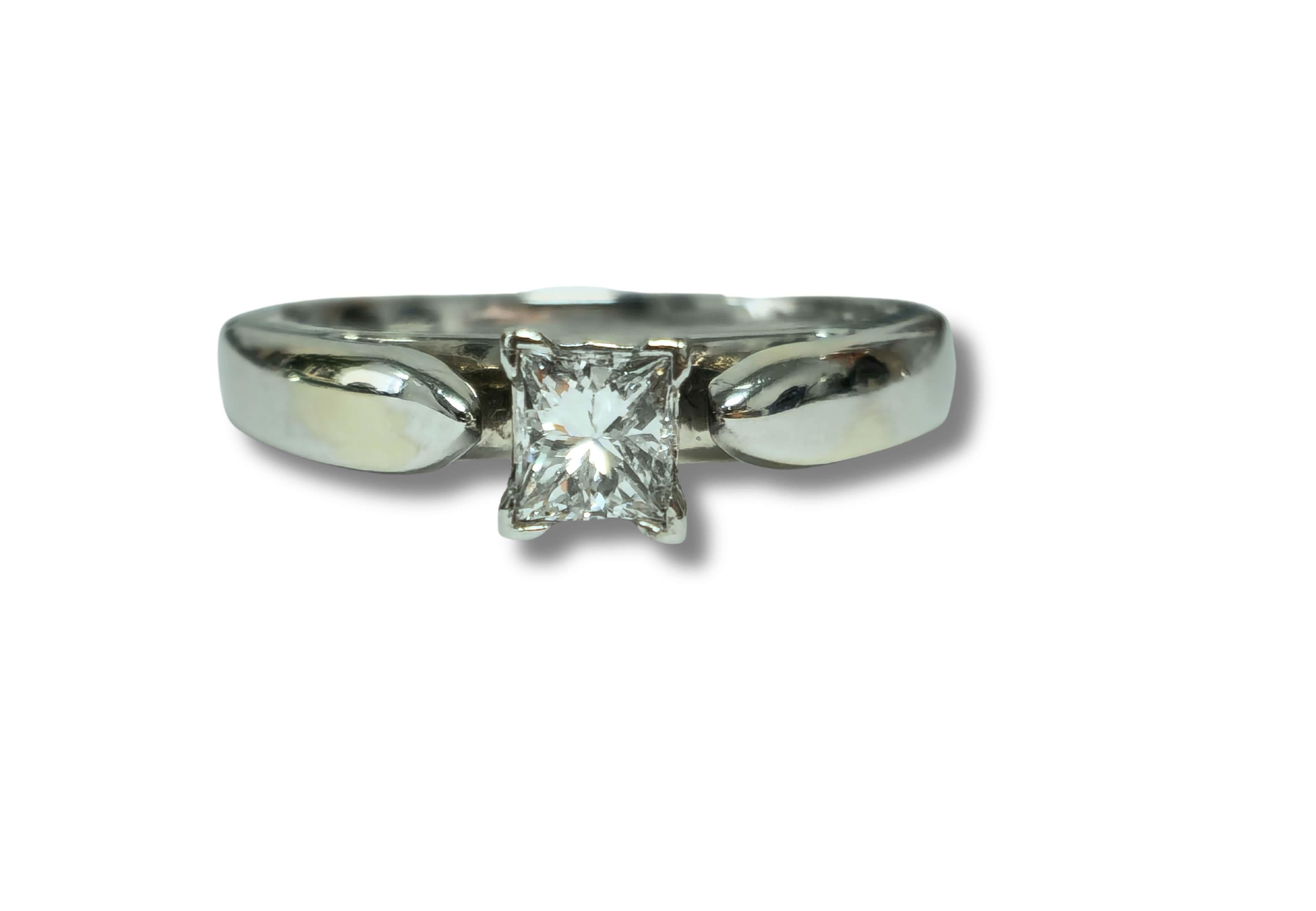 Elevate your proposal with our Classic Solitaire Diamond Engagement Ring, crafted from shimmering 14k white gold. Featuring a dazzling 0.41 carat princess-cut diamond, this ring exudes timeless elegance and sophistication. With its F-G color and