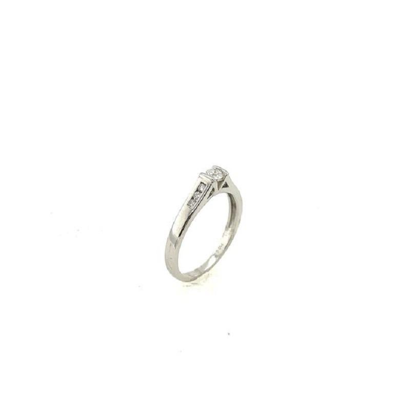 Round Cut Classic Solitaire Diamond Ring with Channel Set Shoulders For Sale