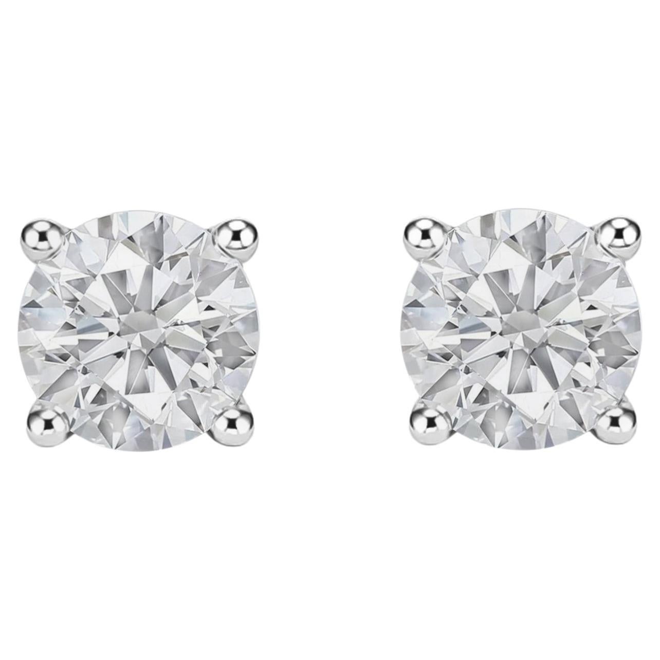 Pendientes clásicos tipo «Solitaire» de oro blanco de 14K con diamantes de talla redonda. Joyería de alta gama
