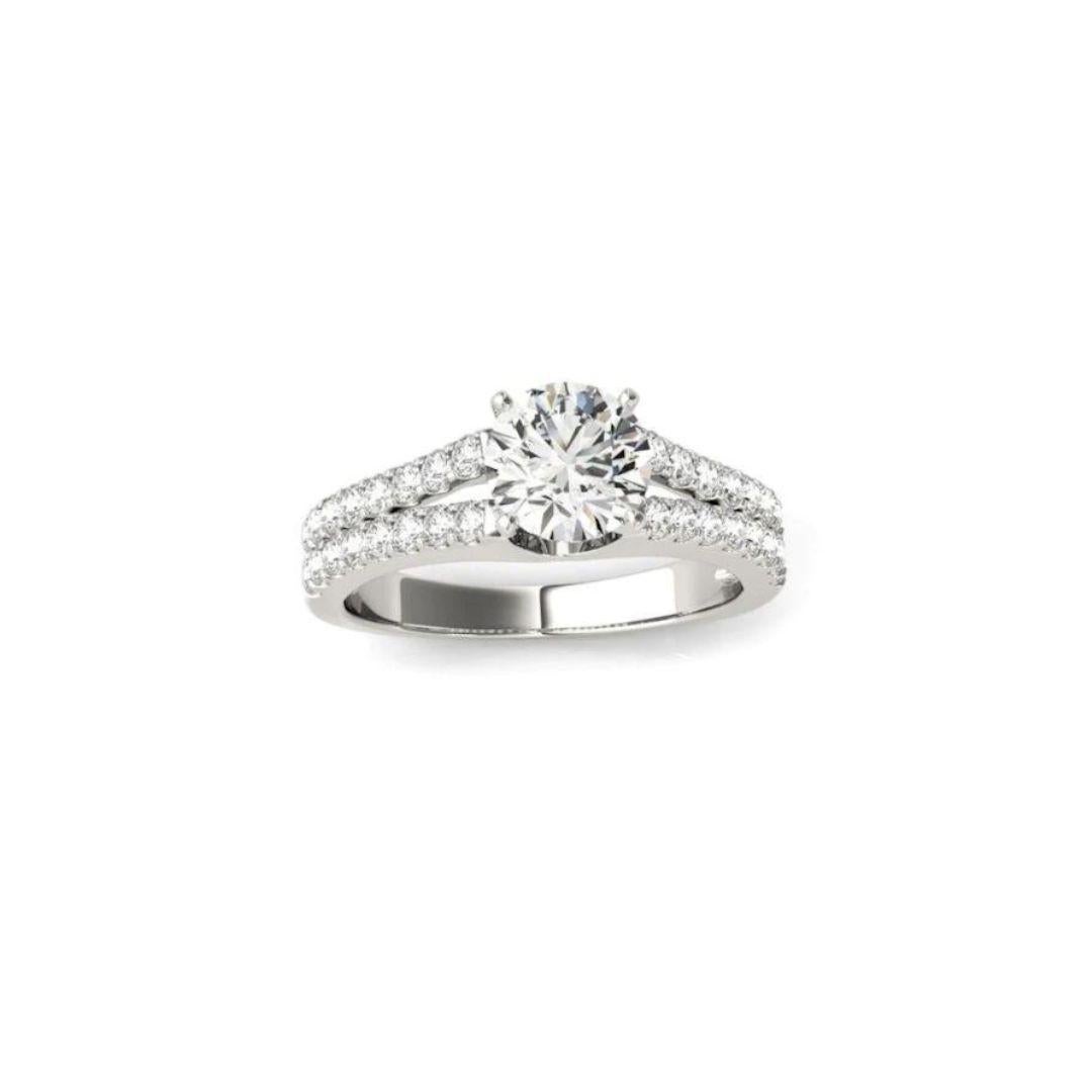 Classic Split Shank Diamond Engagement Mounting in 14k White Gold﻿. Elegant pave set diamonds cover the two side rows of the ring's shoulders, with a total carat weight of 0.20 ctw, H  color, SI1 clarity. Center round brilliant cut natural diamond