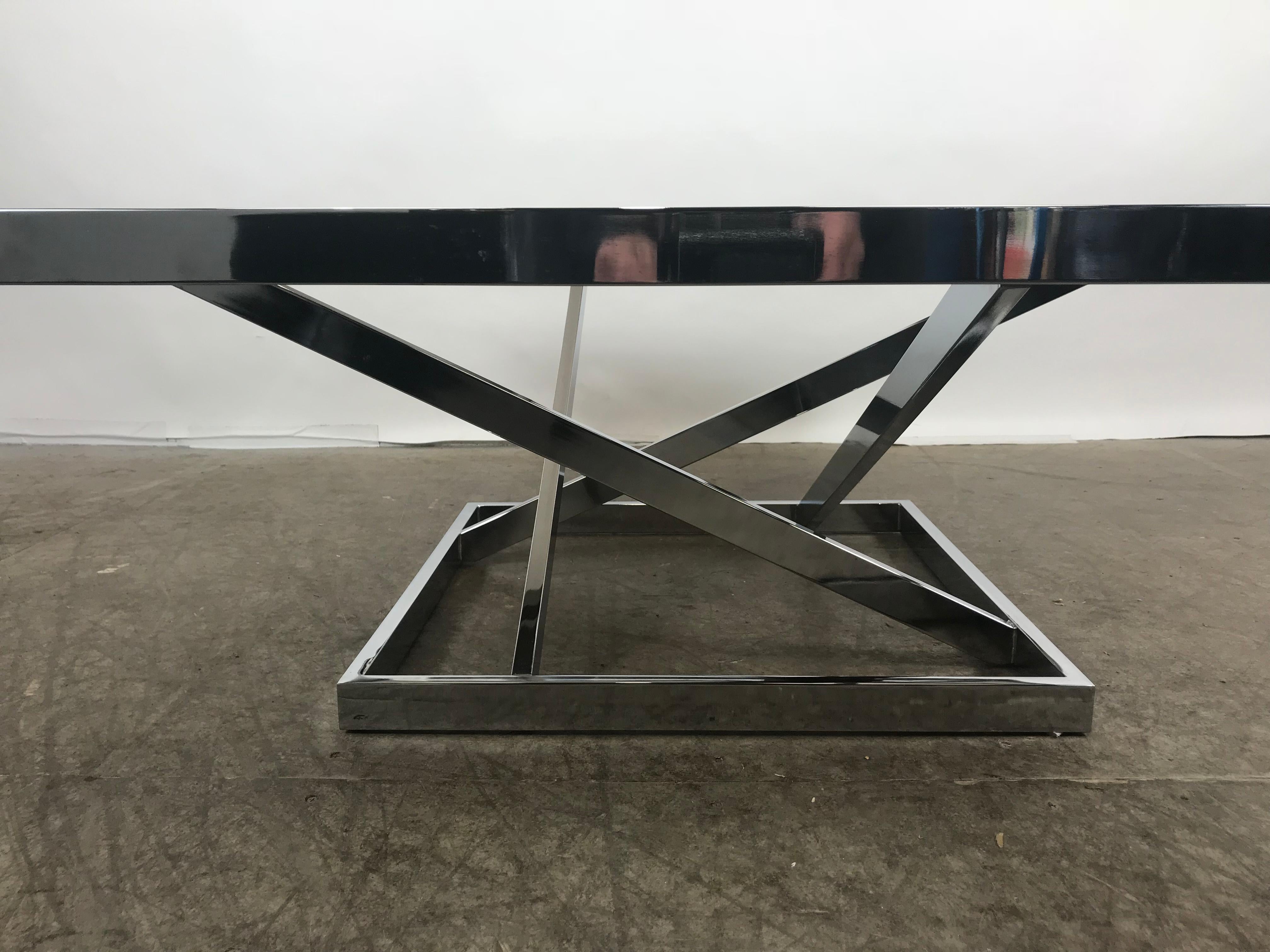 Classic stacked chrome and glass cocktail table in the style of Milo Baughman. Architecturally designed, polished chrome and smoked glass, stunning example of 1970s Modernist design. Hand delivery avail to New York City or anywhere en route from